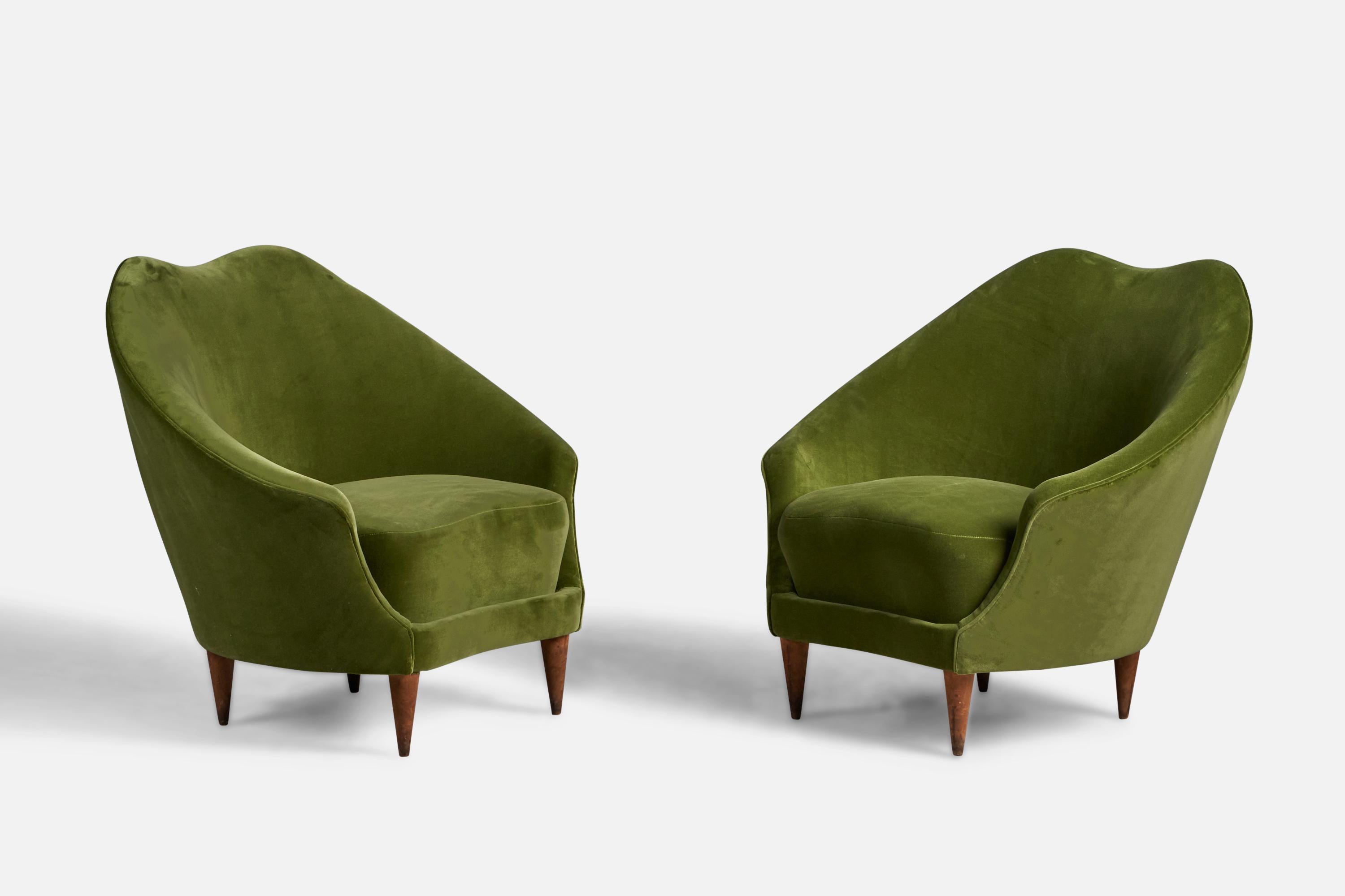 A pair of walnut and green velvet lounge chairs designed by Federico Munari and produced by ISA Bergamo, Italy, 1950s.

16” seat height

