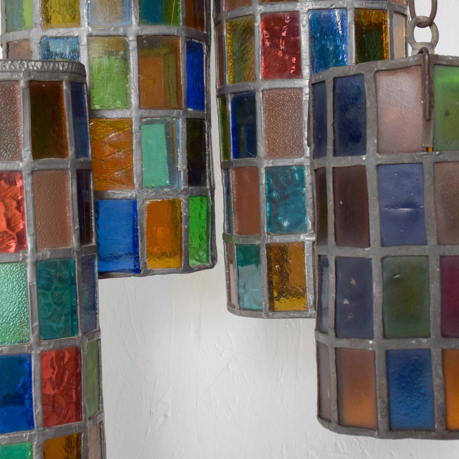 For your consideration: Mexican Modernist by Felipe Delfinger for Feders, 1970s
Colored glass hanging pendant lamp set -includes 5 lamps.
Measurements: 3 sizes, 14 3/4