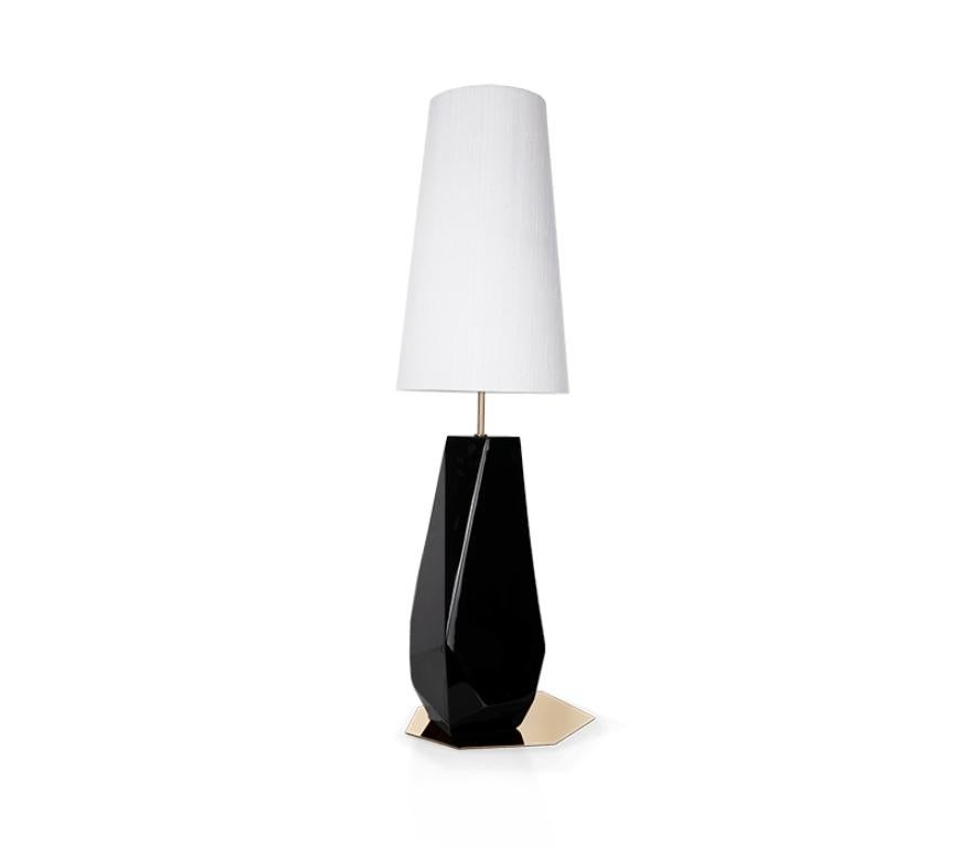 Feel is a table lamp, but actually, it can also be a modern bedside table lamp. It can be elegantly used in your living room as sophisticatedly in your bedroom. Handcrafted by Boca do Lobo, Feel is an exclusive lamp covered with silver leaf, the