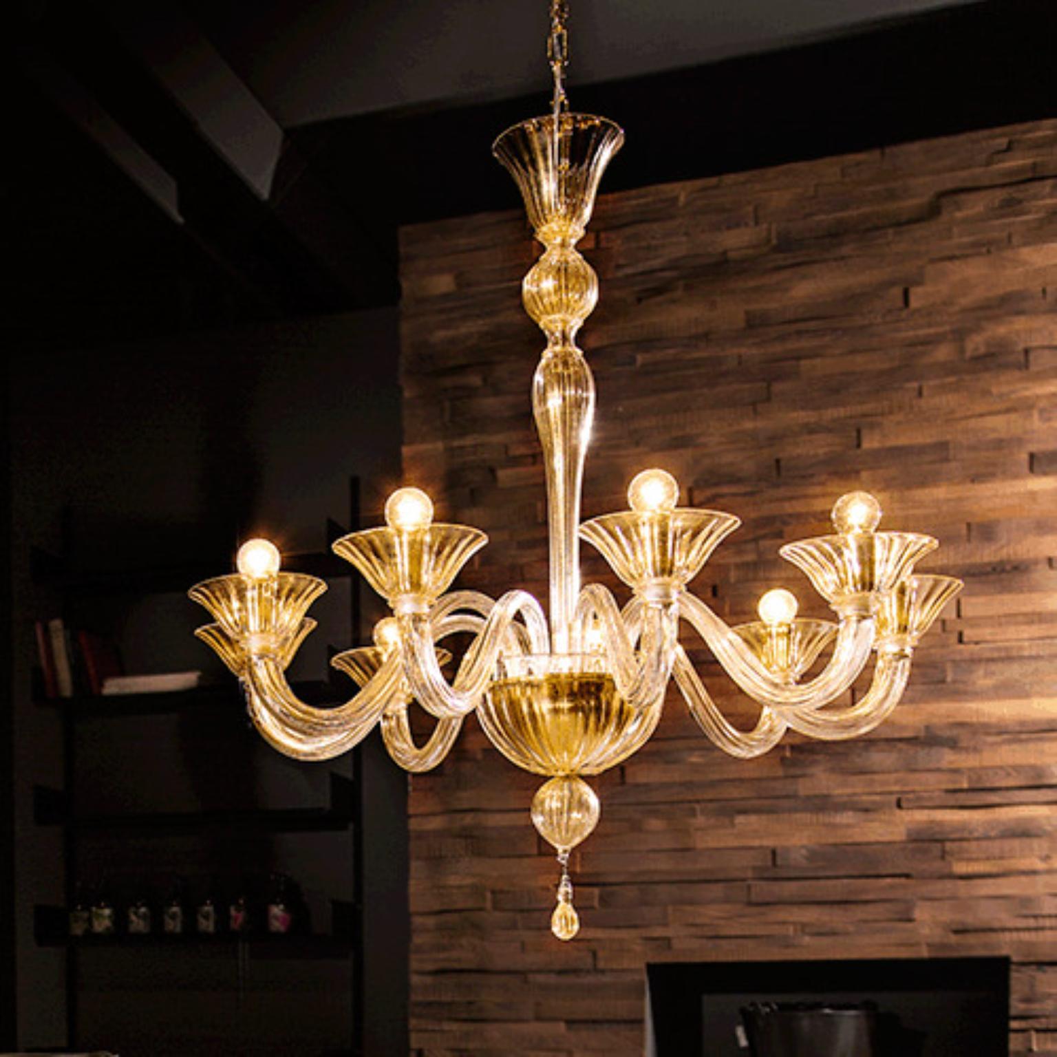 Fegalliano FEGSOV09 Chandelier by Mazzega 1946
Dimensions: D 83 x H 87 cm.
Materials: Frame: Polished Gold. 
Diffuser: Trasparent Amber.
Weight: 007 Kg. 

The roots of Mazzega1946 are in Murano, a land of master glassmakers who still today preserve