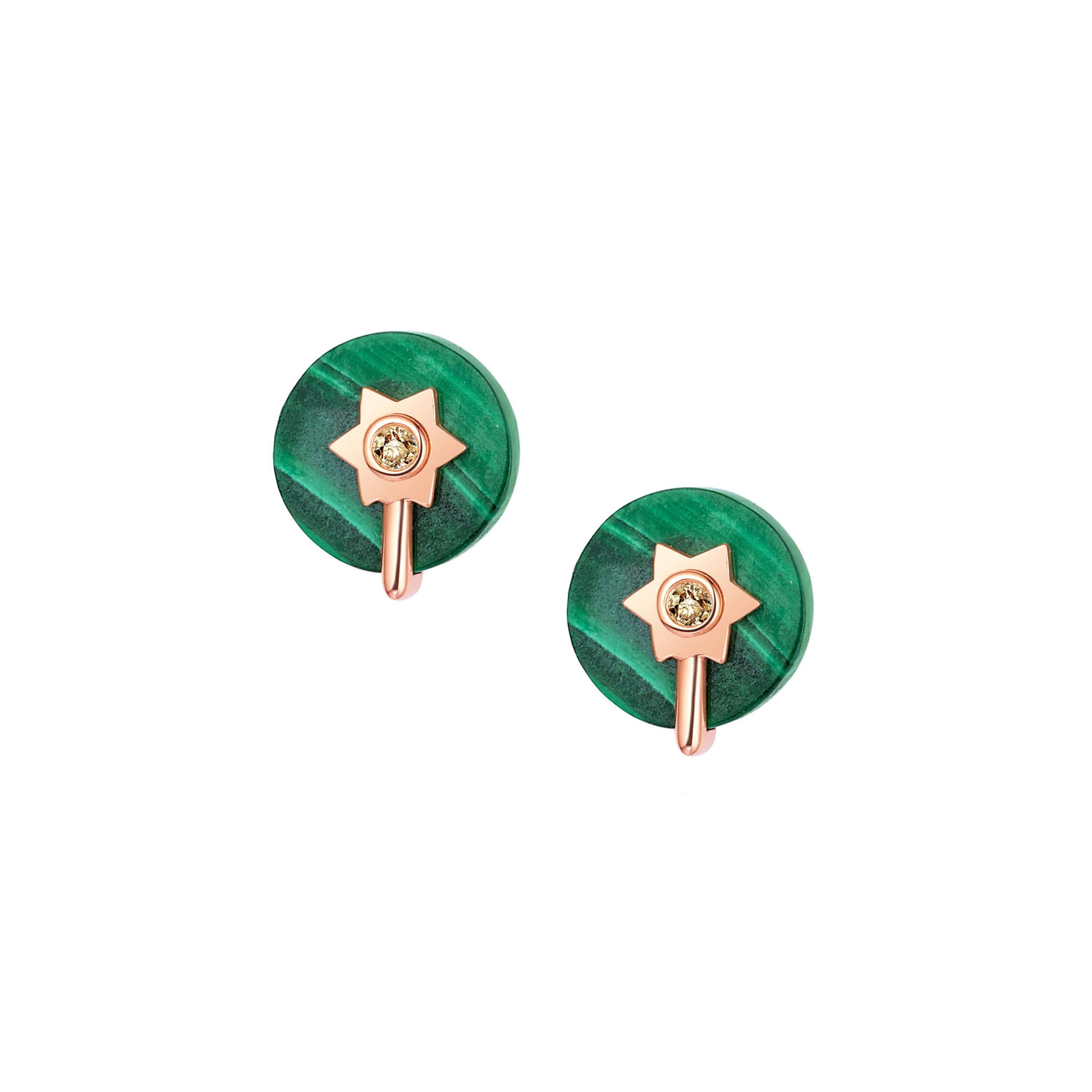Description:
Stella two-way wear earrings with spinning 10mm malachite and 0.042ct champagne diamond set in 14ct rose gold. Wear as dangle earrings, or detach star chain detail for stud earrings.

Inspiration:
The Stella collection was inspired by