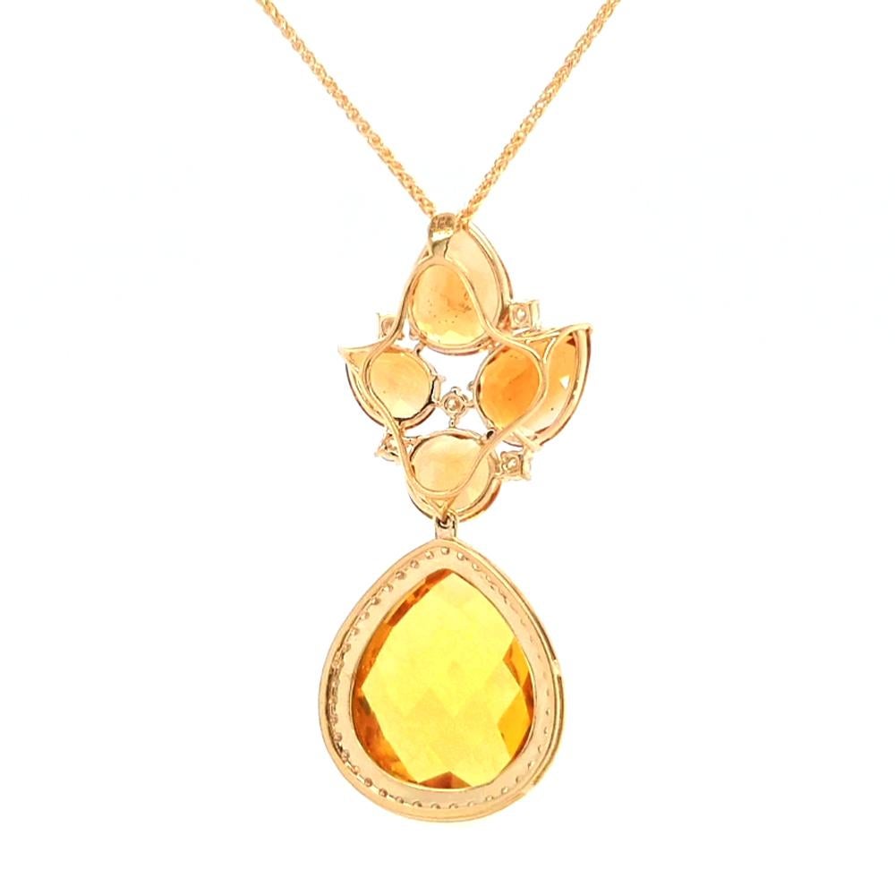 A striking statement citrine pendant necklace, expertly crafted in 18ct yellow gold. This remarkable piece showcases the radiant beauty of various citrines, each carefully cut to highlight their vibrant golden hues. The assortment of citrines is