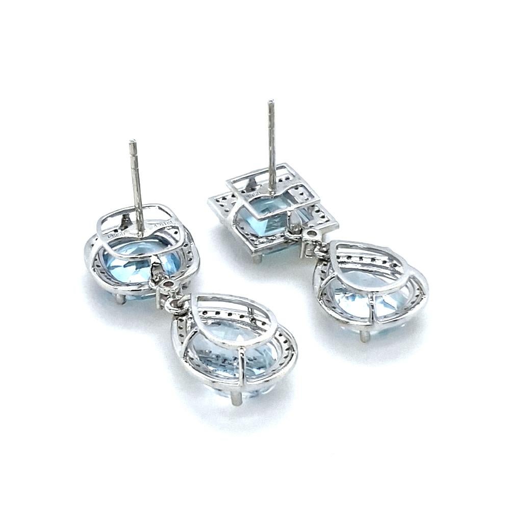 Discover the exquisite beauty of our asymmetric platinum aquamarine earrings, each pair meticulously crafted to capture timeless elegance. One pair features a stunning square-cut aquamarine cascading into a delicate pear-cut aquamarine, both adorned
