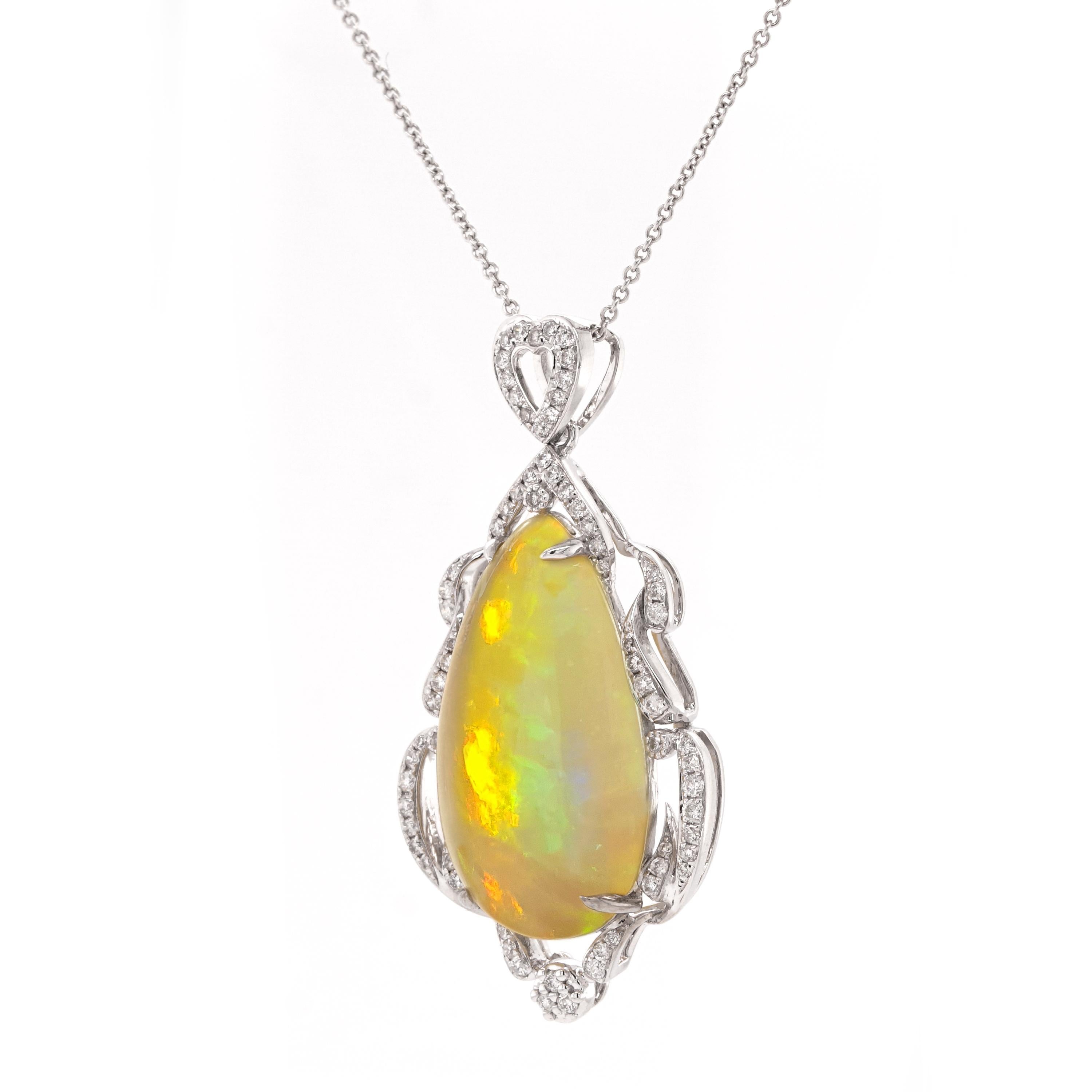 Ethiopian opal pendant with citrusy tones. An 18ct white gold pendant featuring an 8.45ct opal pendant embellished with a frame of sparkling diamonds cascading from a heart-shaped bail.

- Pendant size (HxWxD): 38 × 20 × 7mm
- Chain length: 16