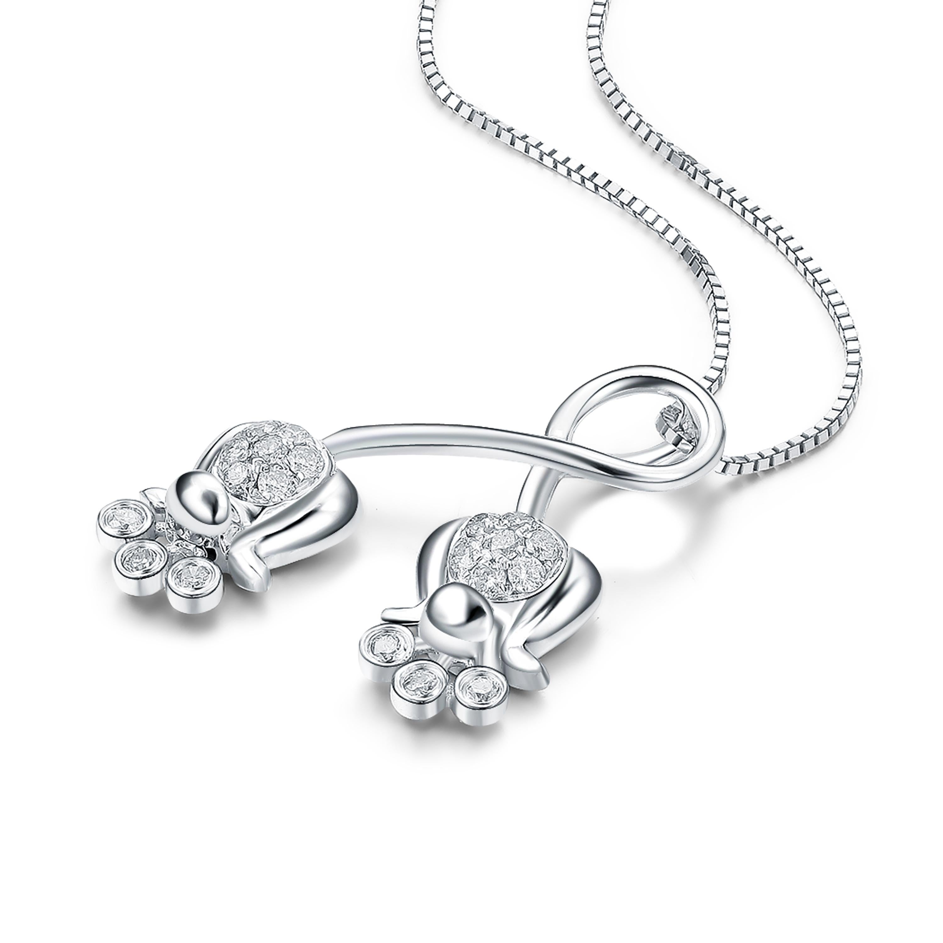 Description:
Lily of the Valley double pendant with 0.185ct white diamonds, set in 9ct white gold with a high polish. Chain length is 16 inches + 2 inch extension.

Inspiration:
The lily of the valley flower is one of the most beloved, opulent