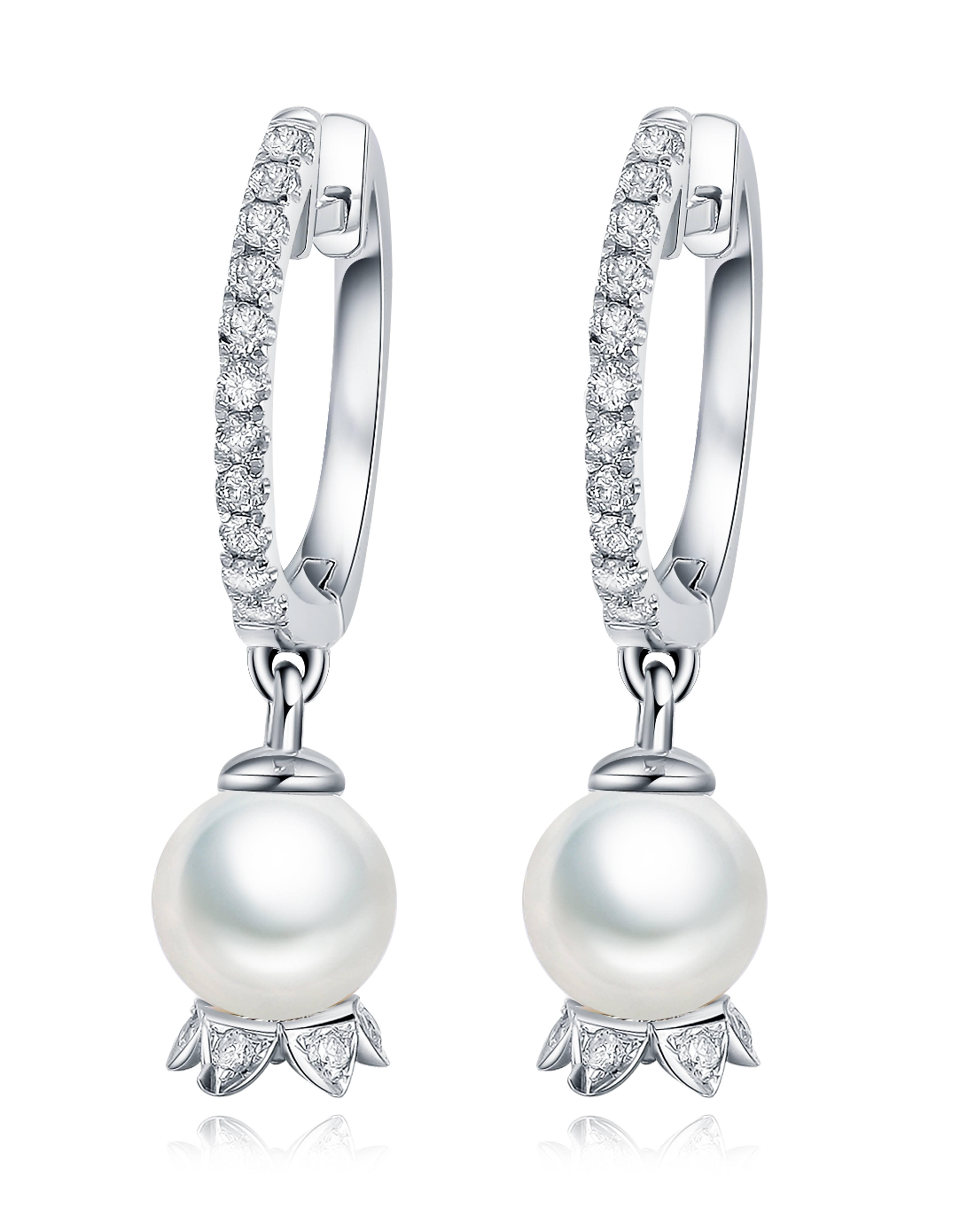 Description:
Lily of the Valley pearl drop earrings with 6mm pearls and 0.211ct white diamonds, set in 9ct white gold.

Inspiration:
The lily of the valley flower is one of the most beloved, opulent wedding flowers, which symbolises purity and