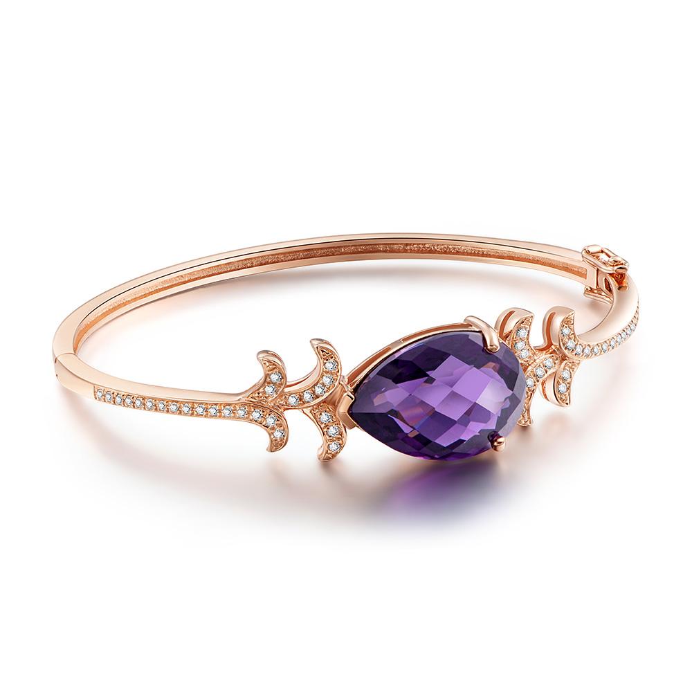 The silver Whispering collection redefines the sumptuous luxury provided by its fine jewellery counterpart, with its exotic shapes derived from the decadent orchid flower. Whispering bangle featuring a purple amethyst decorated with white cubic