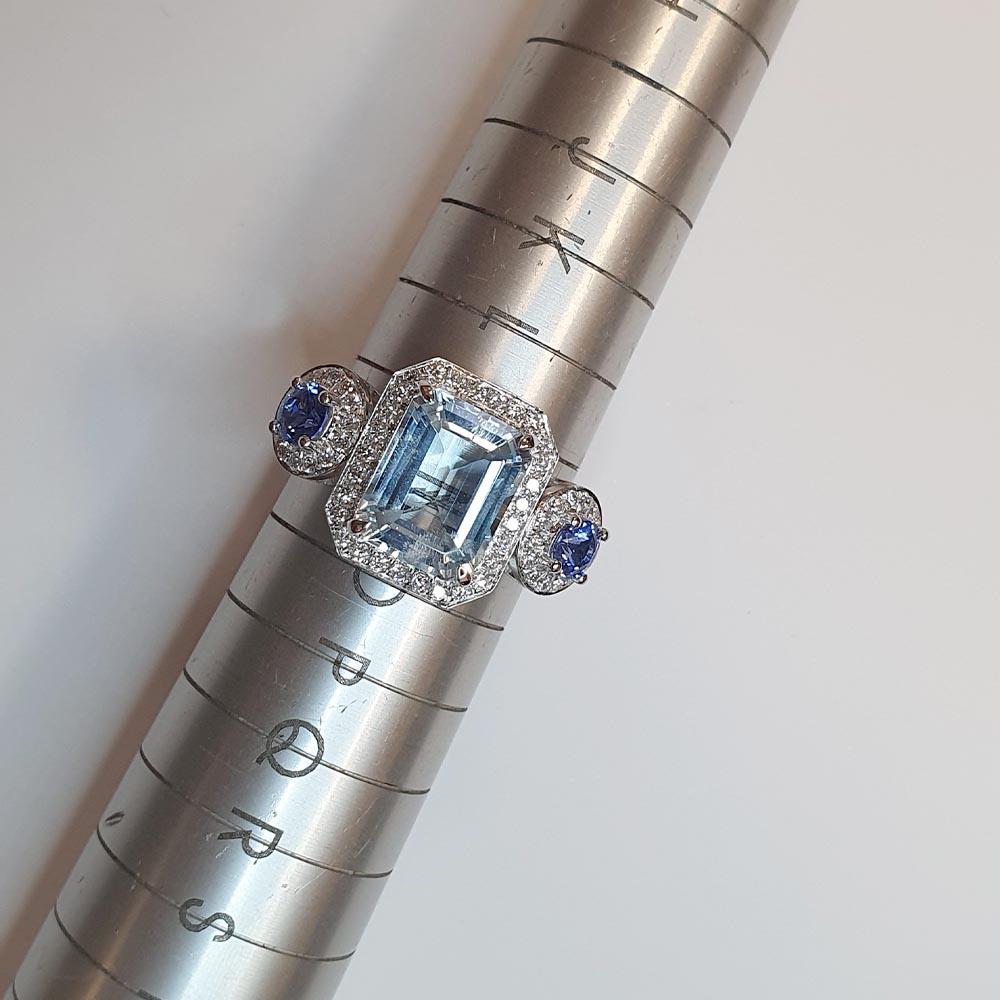 Contemporary Fei Liu Aquamarine, Diamond Halo and Sapphire Platinum Three-Stone Ring