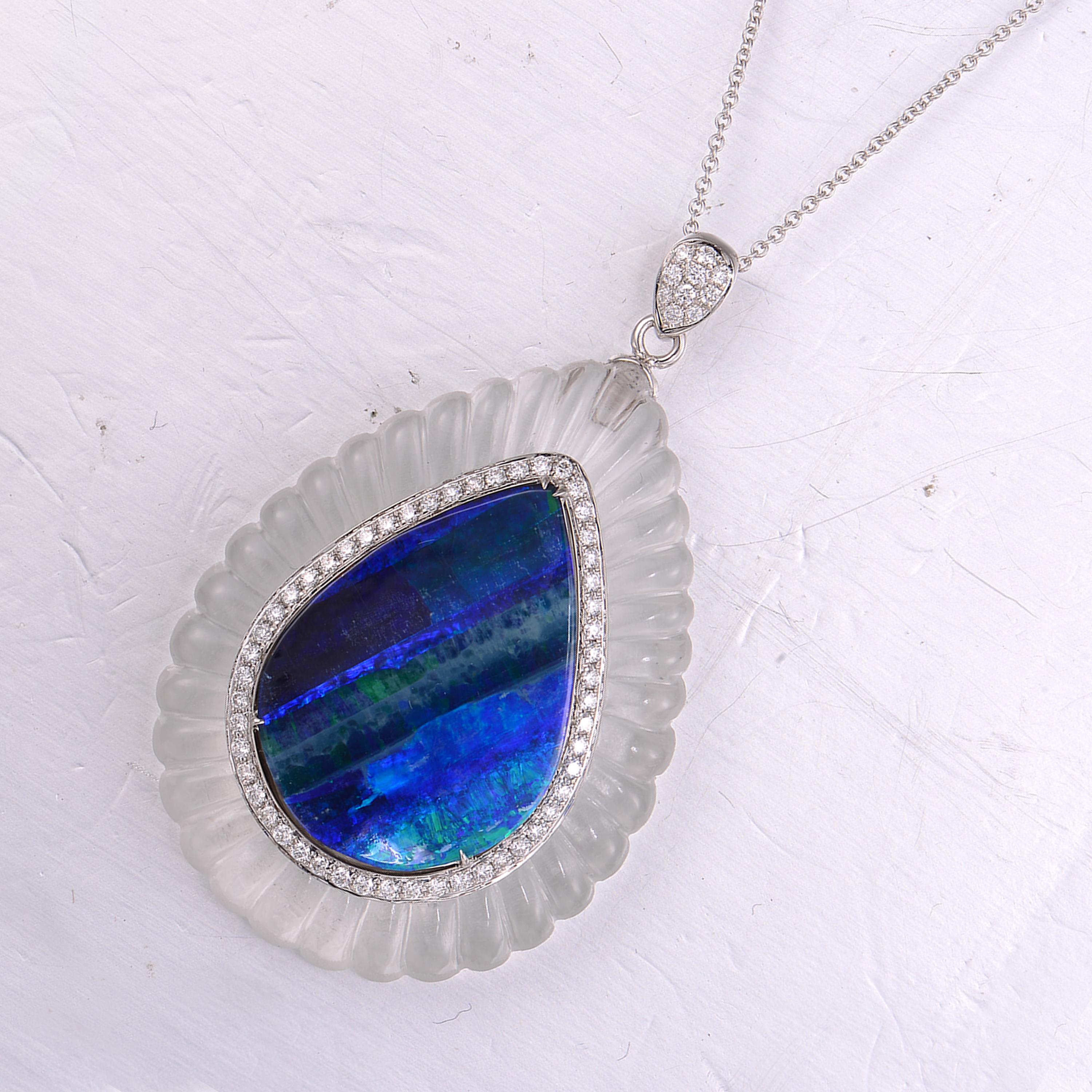 Description:
Painterly blue and green tear-shaped 8.4ct opal, decorated with brilliant 0.5ct diamonds and  57.25ct scalloped rock crystal. The matte finished rock crystal not only adds a modern touch to an Art Deco-inspired piece but also