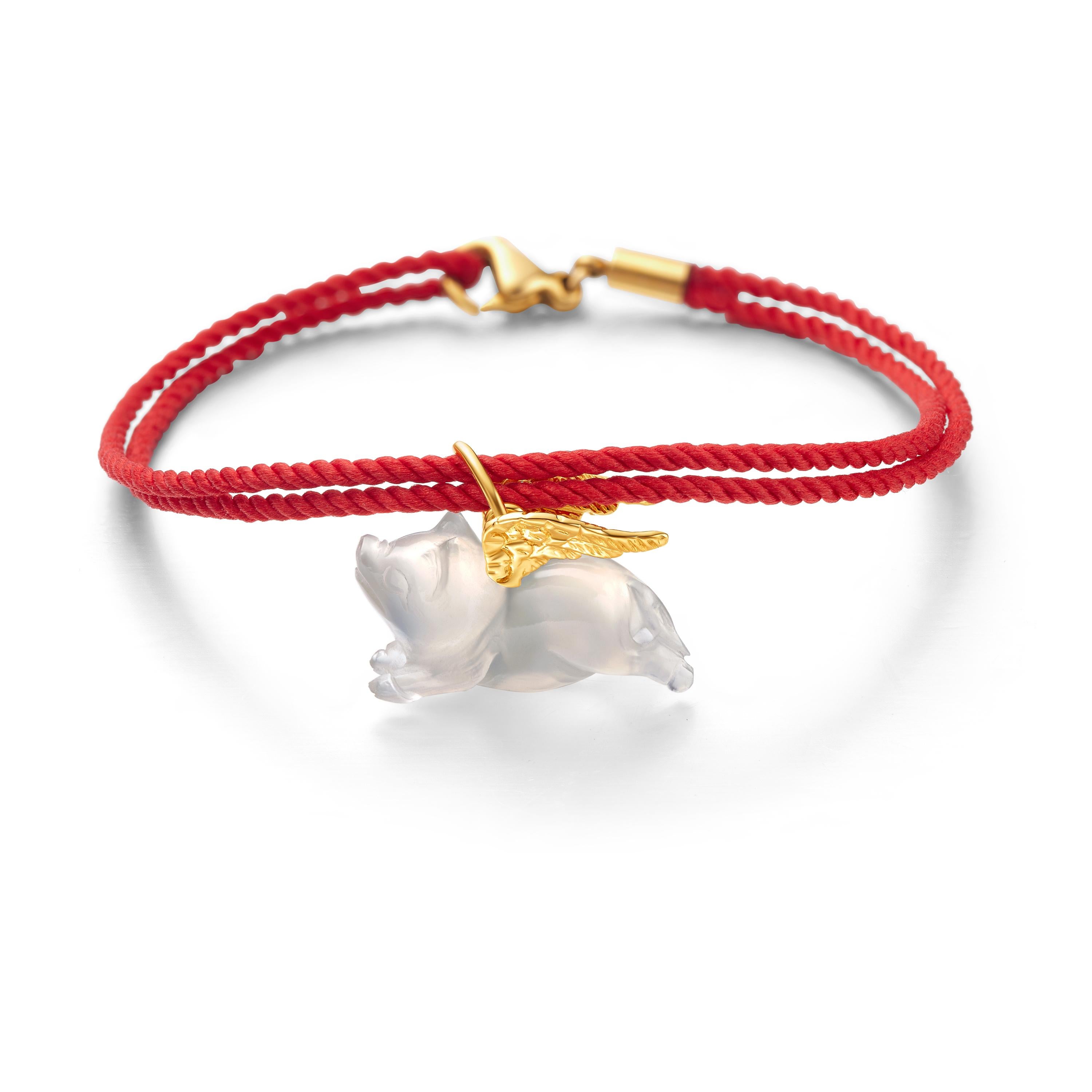 Embrace the symbolic charm of the Pig with this versatile pendant and bracelet. Representing prosperity, kindness, and good fortune, this delightful piece features a smooth 7.3mm x 18.4mm chalcedony body with elegant yellow gold-plated wings.