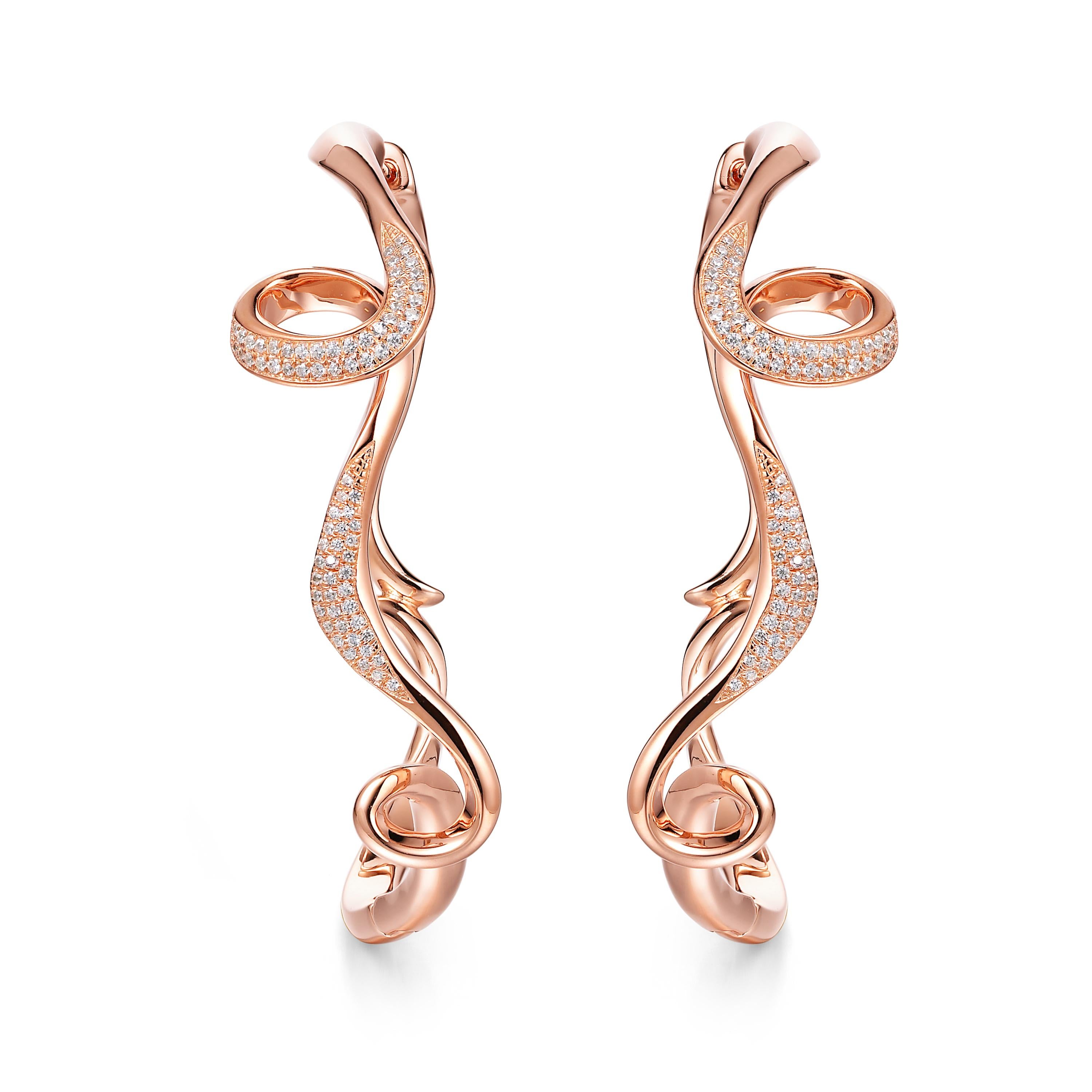 Description:
Serenity large hoop earrings shimmering with Hearts and Arrows* cubic zirconia set in 18ct rose gold plated on sterling silver.

*Hearts and Arrows refer to the diamond cut quality. Our cubic zirconia is cut with 28 extra facets to give