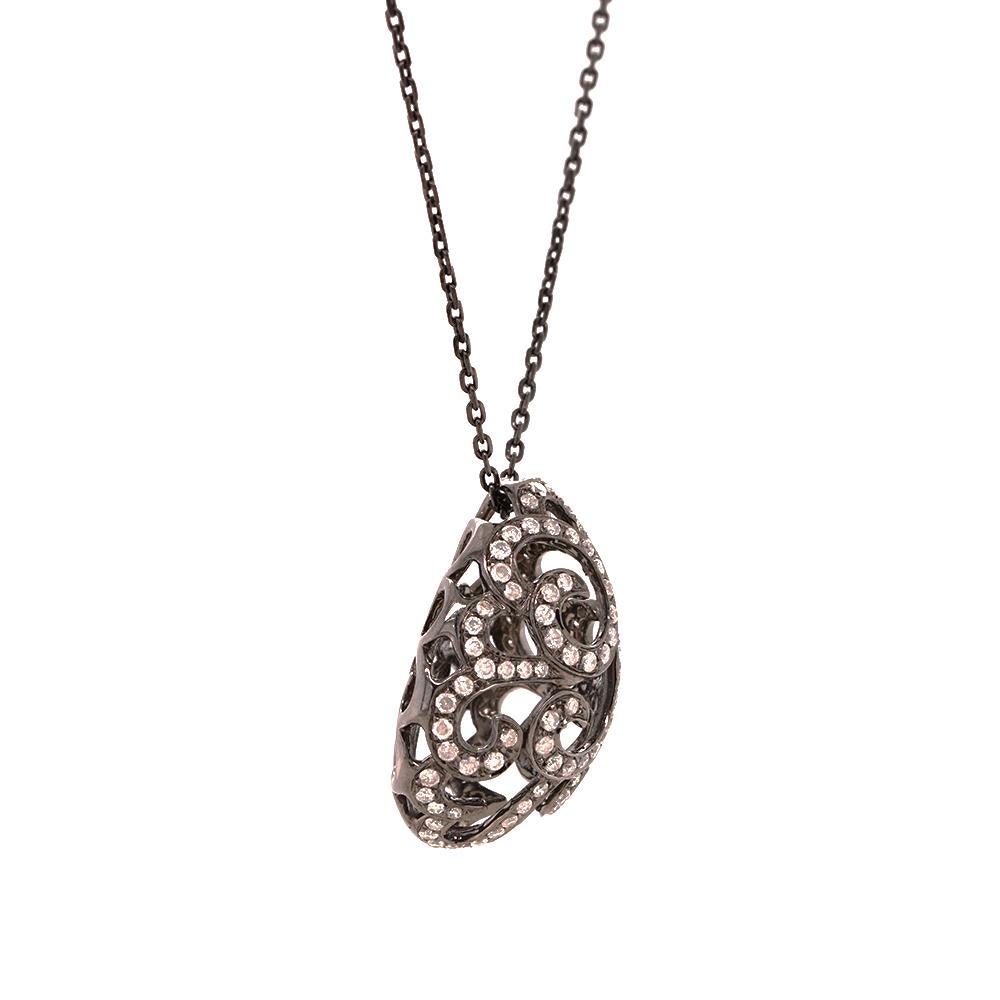 Emulating femininity and glamour, the Whispering collection is full of colour and form. Inspired by the twisting, sculptural shape of the exotic Orchid flower. Whispering large filigree egg pendant with approx. 0.65ct white diamonds set in black