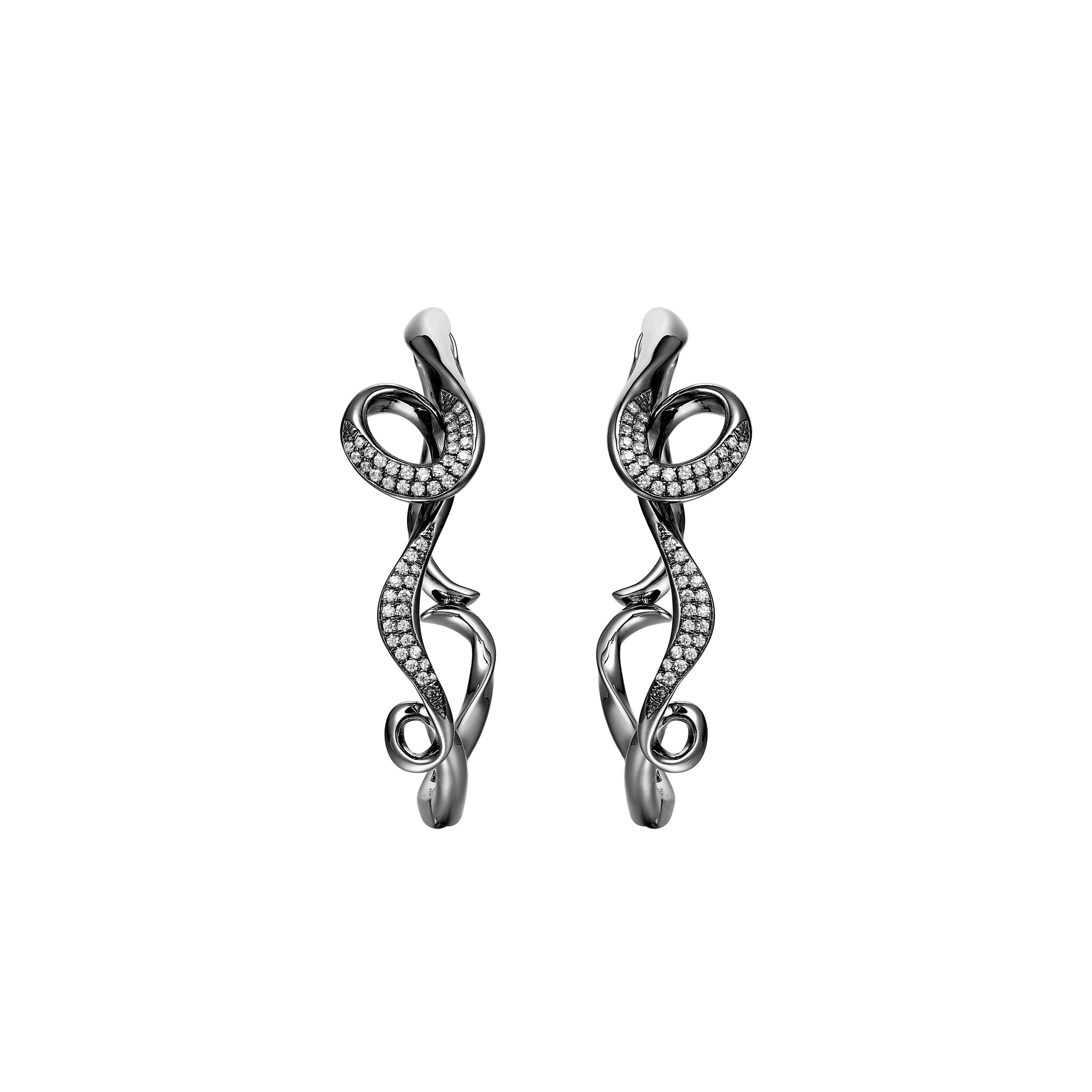 Description:
Serenity small hoops with 0.192ct white diamonds, set in black rhodium plate on sterling silver.

Inspiration:
Serenity Collection in limited edition diamonds, inspired by the flow and curves of the smoke of incense. Promoting a calm