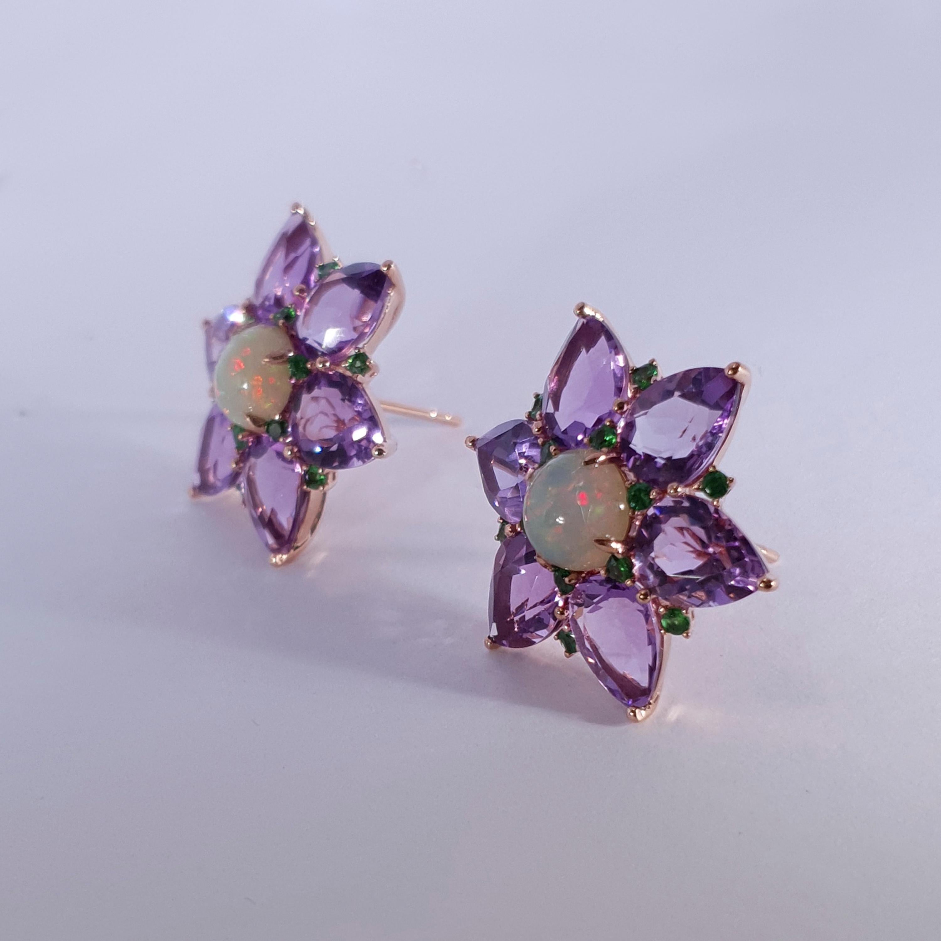 Description:
Statement earrings inspired by the vibrant florals of nature. Featuring central fiery opals, petals of purple amethyst and vibrant accents of demantoid set in contrasting 18ct rose gold.

Specification:
Dimensions (LxW): 25mm x