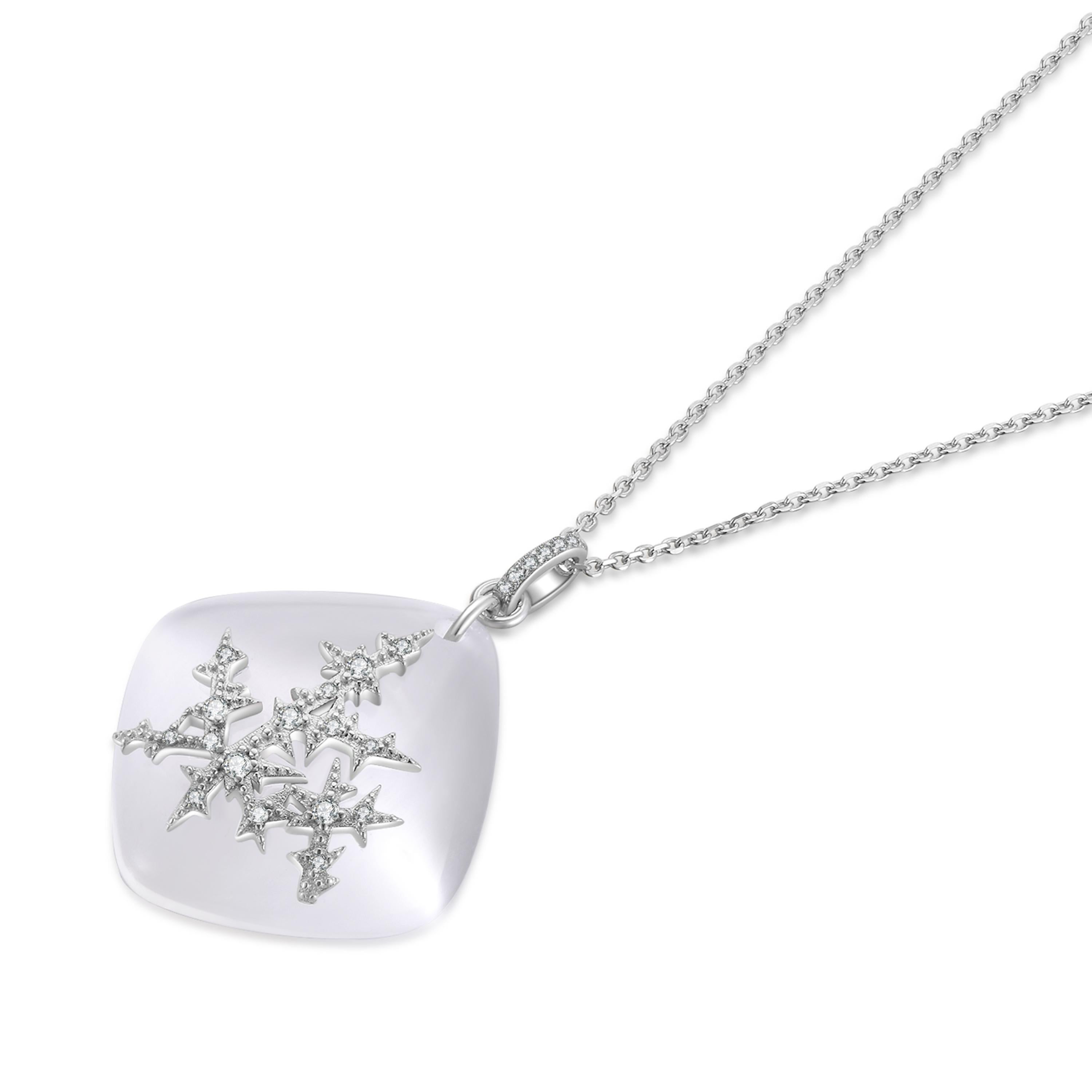 The exquisite limited edition Snowflake Pendant – a beautiful fusion of elegance and winter enchantment. This enchanting piece features a milky white kite-cut cat’s eye stone, delicately adorned with a meticulously crafted snowflake overlay, set