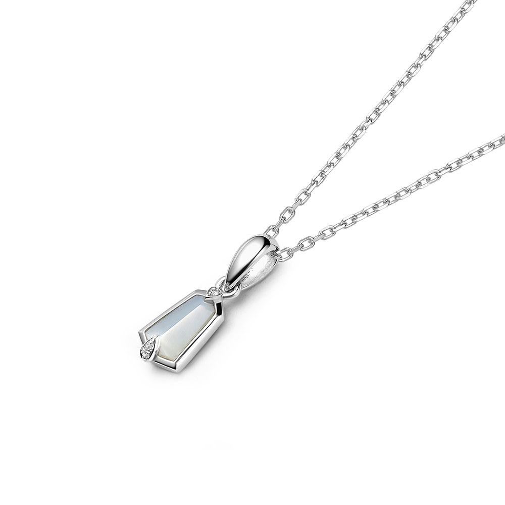 Geometric and elegant silhouettes are epitomised across the 18ct gold Nova Collection, which follows the strong structure of a kite. Nova small kite pendant featuring a kite-cut mother of pearl set in diamond-set claws of 18ct white gold. A small