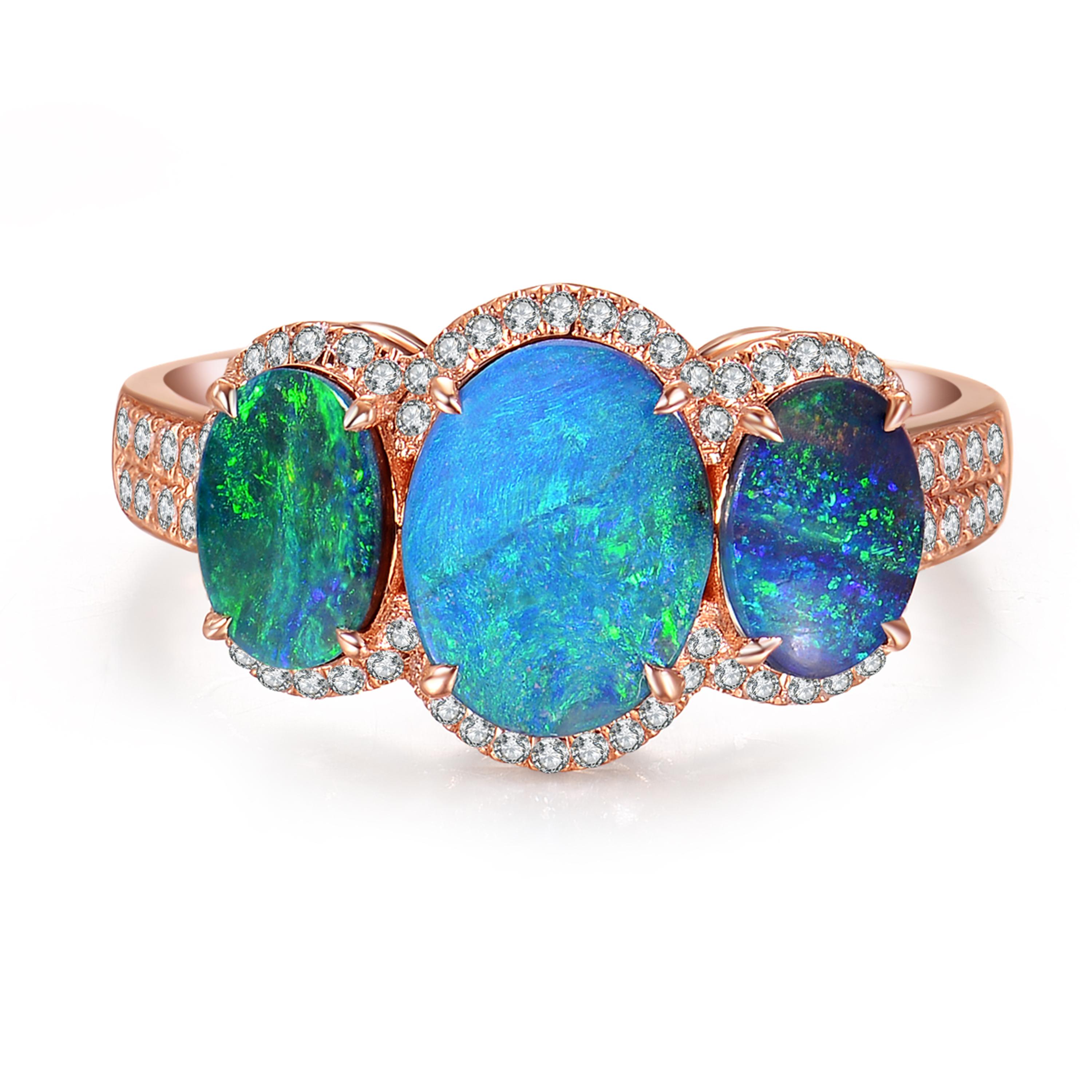 Description:
A one-off opal trilogy ring set with a trio of mesmerising blue green oval opals with a total weight of 2.25ct and 0.3ct brilliant diamonds, set in 18ct rose gold. 

Opal care: The best way to clean opals is with lukewarm soapy water