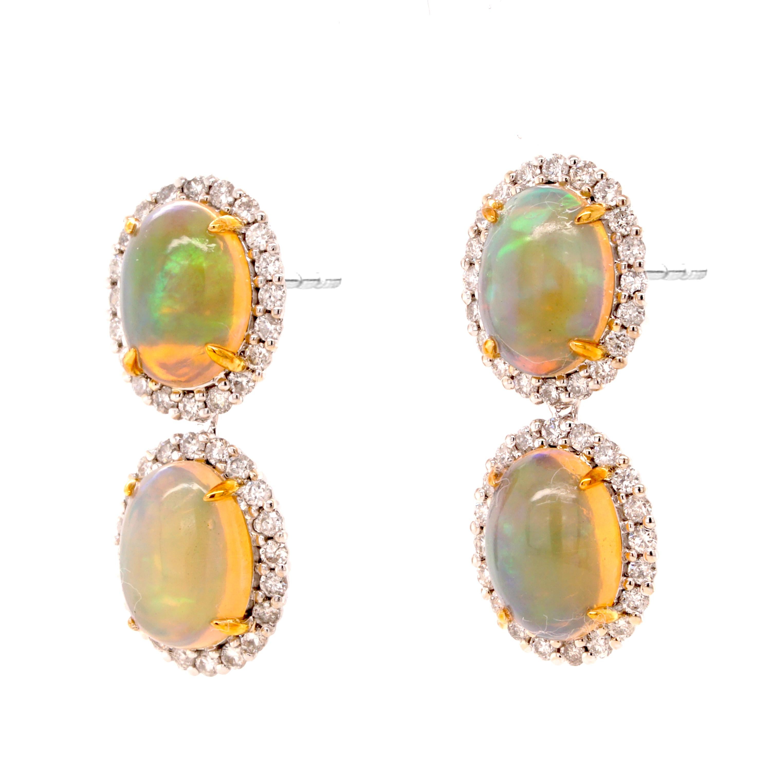 Opalescent earrings in 18ct white gold and accents of yellow gold. Featuring 3ct opals bordered with 0.56ct diamonds.

- Dimensions (HxW): 22 x 9mm
- Weight per earring: 2.2gm
- Fitting: post and butterfly

Fei Liu Fine Jewellery is an independent
