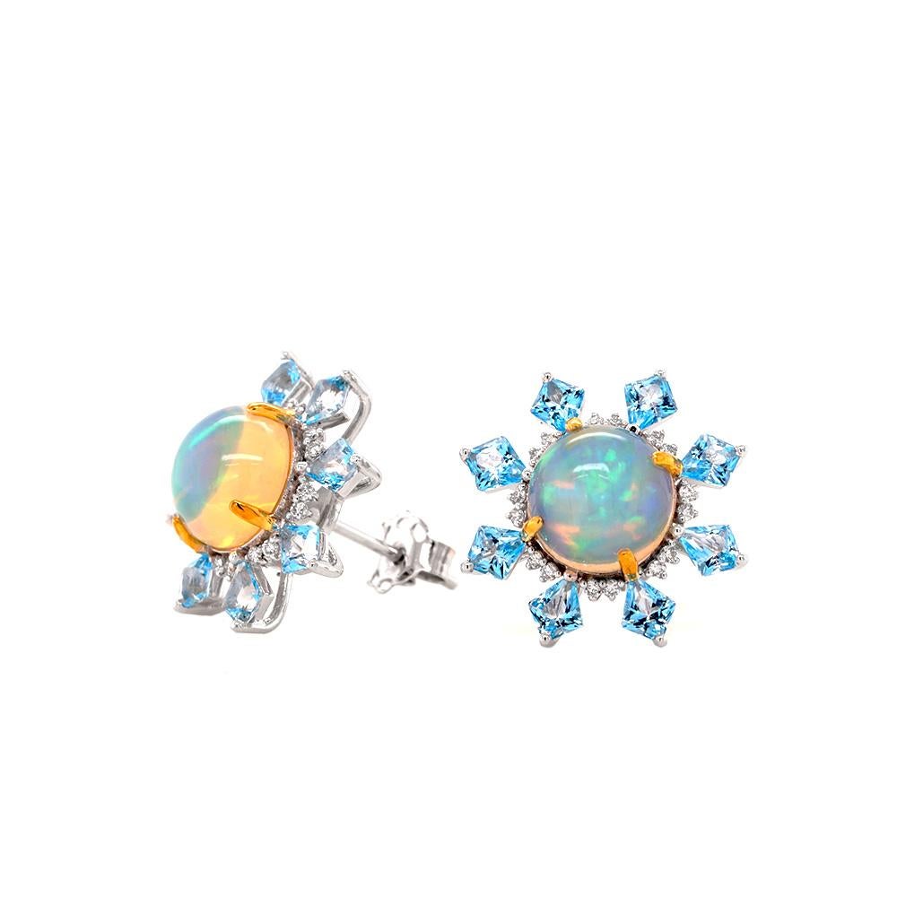 A pair of enchanting earrings crafted in 18ct white gold adorned with delicate yellow gold-plated accents. Each stud earring is a one-of-a-kind designer, featuring an iridescent opal of 1.455ct weight, bordered by a halo of dazzling diamonds