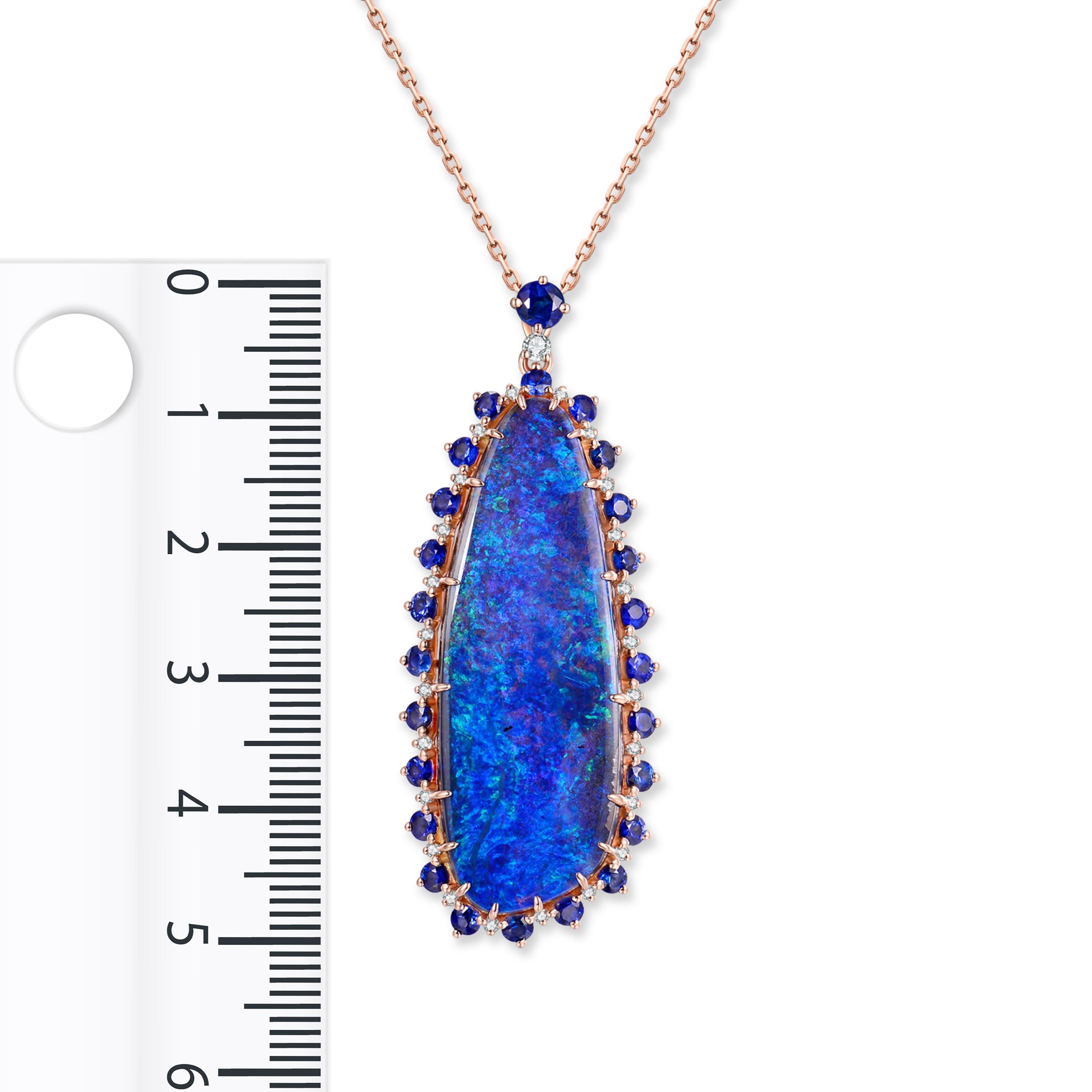 Description:
A one-of-a-kind midnight blue 36.3ct opal pendant, bordered with 0.36ct brilliant diamonds and 2.02ct deep blue sapphires set in 18 karat rose gold.

Opal care: Clean opals with lukewarm soapy water.

Specification:
Size (LxW): 50mm x