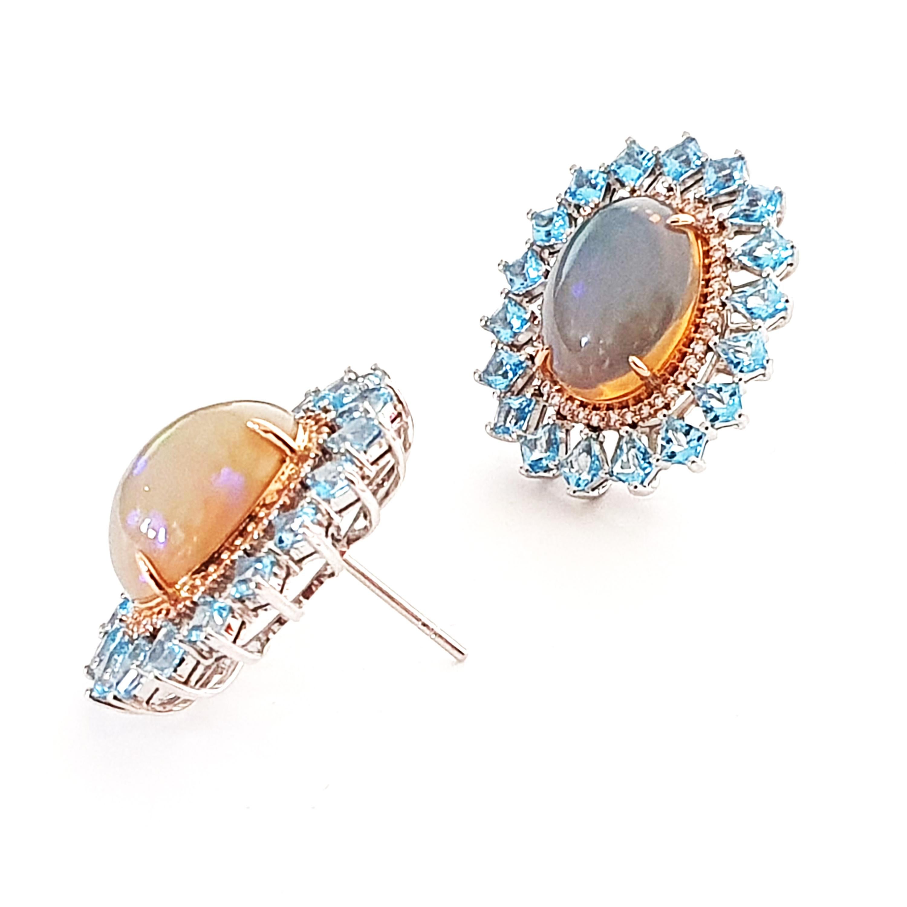 Description:
Stunning one-of-a-king two-tone gold stud earrings. Features opals with a total weight of 7.56ct, bordered with diamonds totalling 0.38ct and topaz totalling 4.00ct in 18ct white gold. The opal is set in accents of rose gold plate.
-