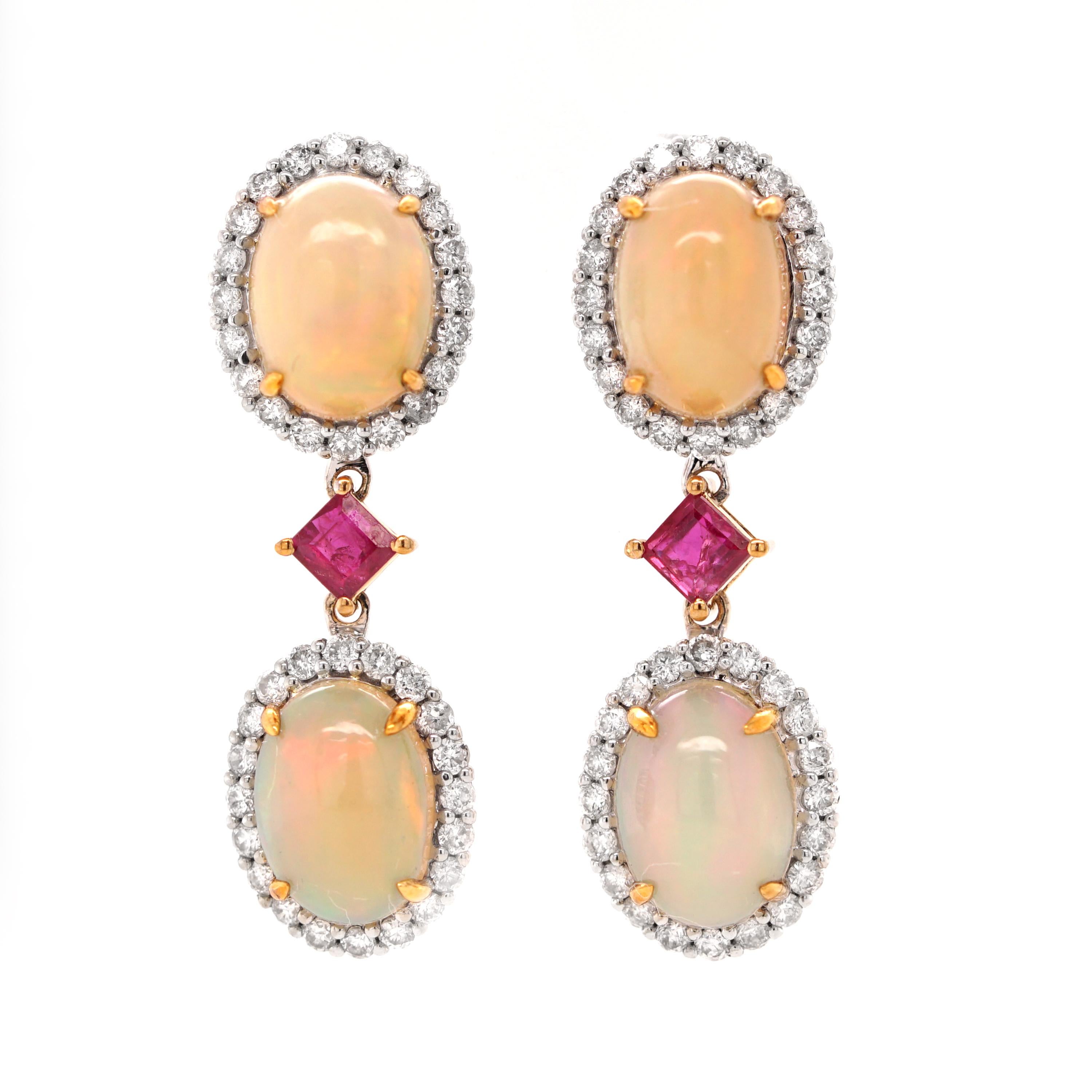 Description:
Opalescent earrings in 18ct white gold and accents of yellow gold. Featuring 3.58ct opals decorated with 0.56ct diamonds and 3ct rubies.

- Dimensions (HxW): 27 x 9mm
- Weight: 2.2gm
- Fitting: post and butterfly

About Fei Liu Fine