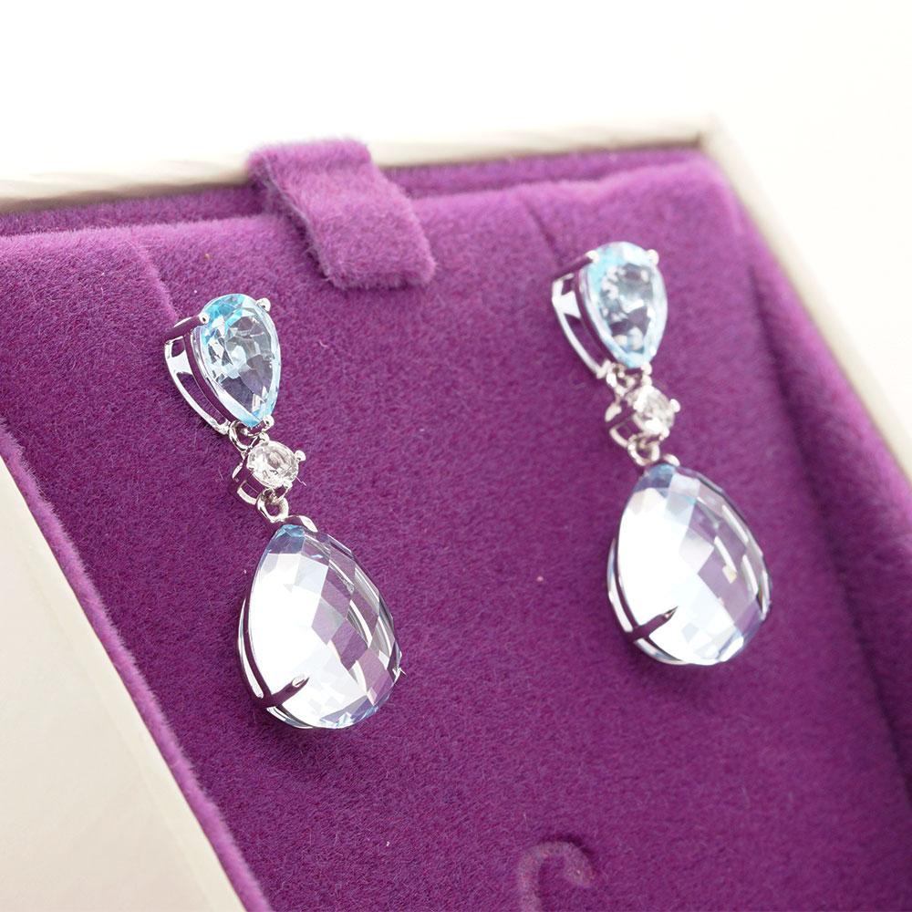 Add a pop of colour to your look with vibrant gems from Mother Nature. These drop earrings feature two gems, one pear-cut topaz and one briolette amethyst, interspersed with a scintillating sapphire. Each gemstone harmoniously exhibits beauty within