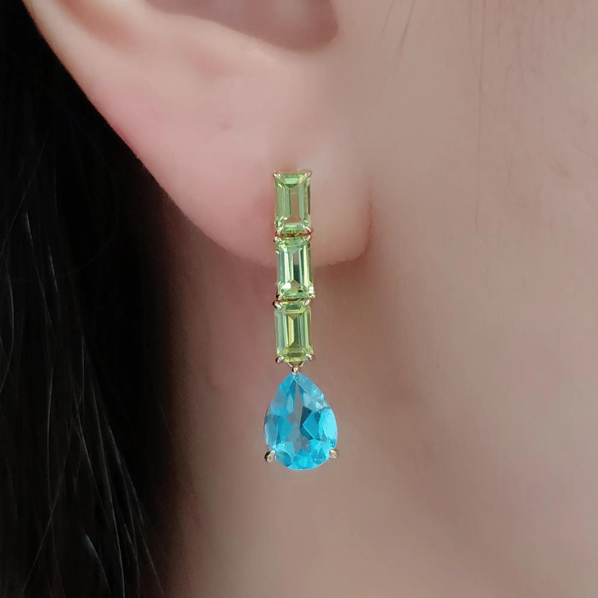 Una sinfonia di colori e forme, questi orecchini a goccia sono caratterizzati da un trio verticale di peridoti da 1,172 carati: la loro fresca tonalità verde evoca foglie primaverili e prati illuminati dal sole. Ogni orecchino è impreziosito da un