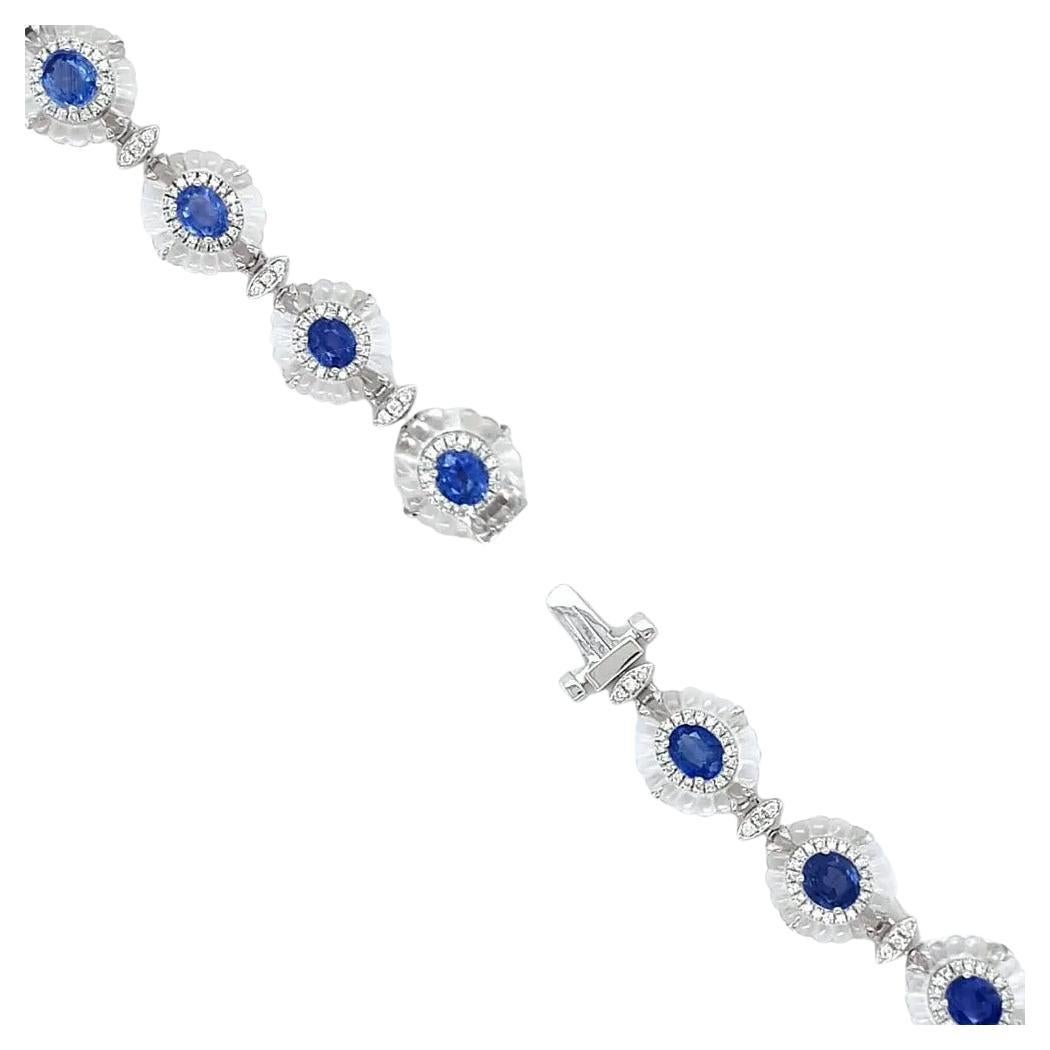 This exquisite 7-inch bracelet is a testament to elegance and craftsmanship, featuring ten mesmerising sapphires, each radiating a deep, rich blue hue. Surrounding each sapphire is a dazzling diamond halo, enhancing the brilliance of the central