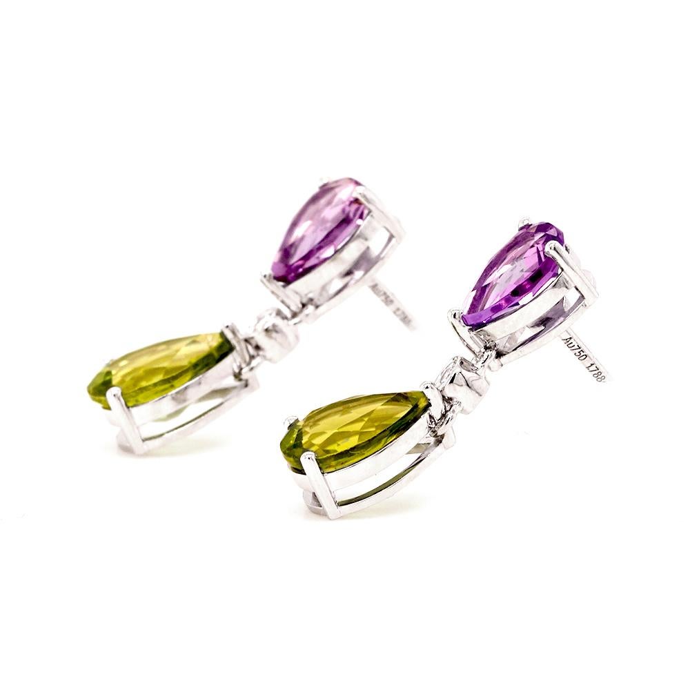 Add a touch of colour to your look with bright, breathtaking gemstones. These drop earrings feature two pear-cut purple amethysts, each cascading with bezel-set diamonds and pear-cut peridot set in 18ct white gold.

- Dimensions (HxW): 19mm x 6mm
-