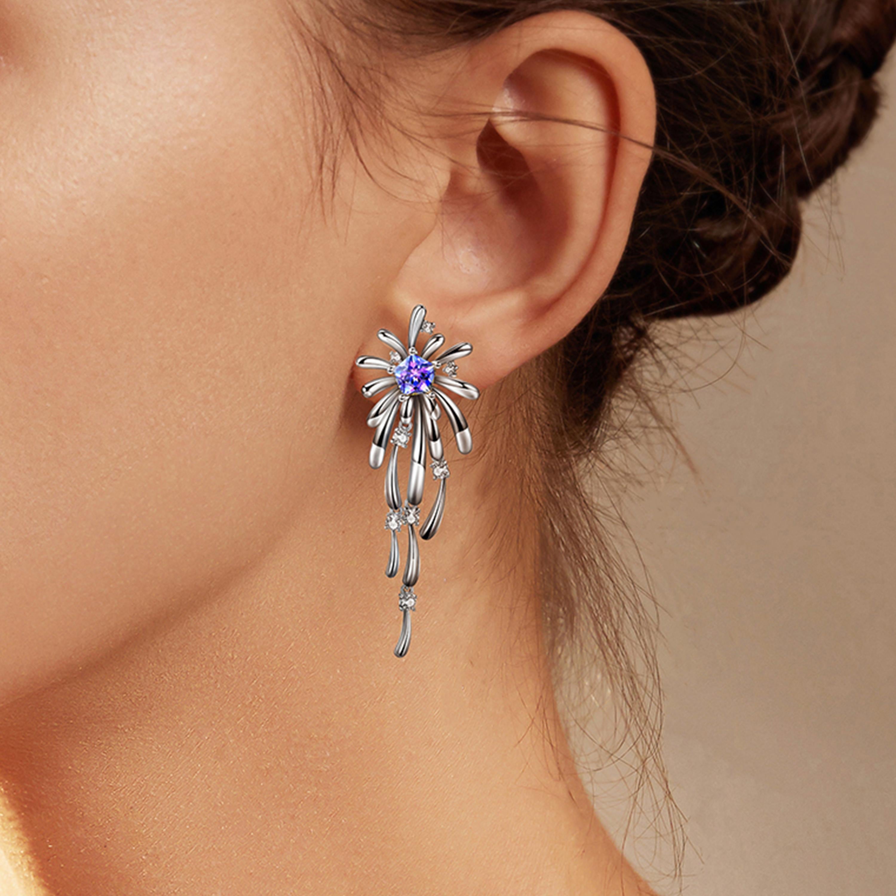 Description:
Light up the room with the new Carpe Diem Collection by Fei Liu! Carpe Diem 'Crossette' drop earrings with Swarovski Purple-Aqua Pentagon Star cubic zirconia and 8 hearts and 8 arrows CZ, set in white rhodium plate on sterling