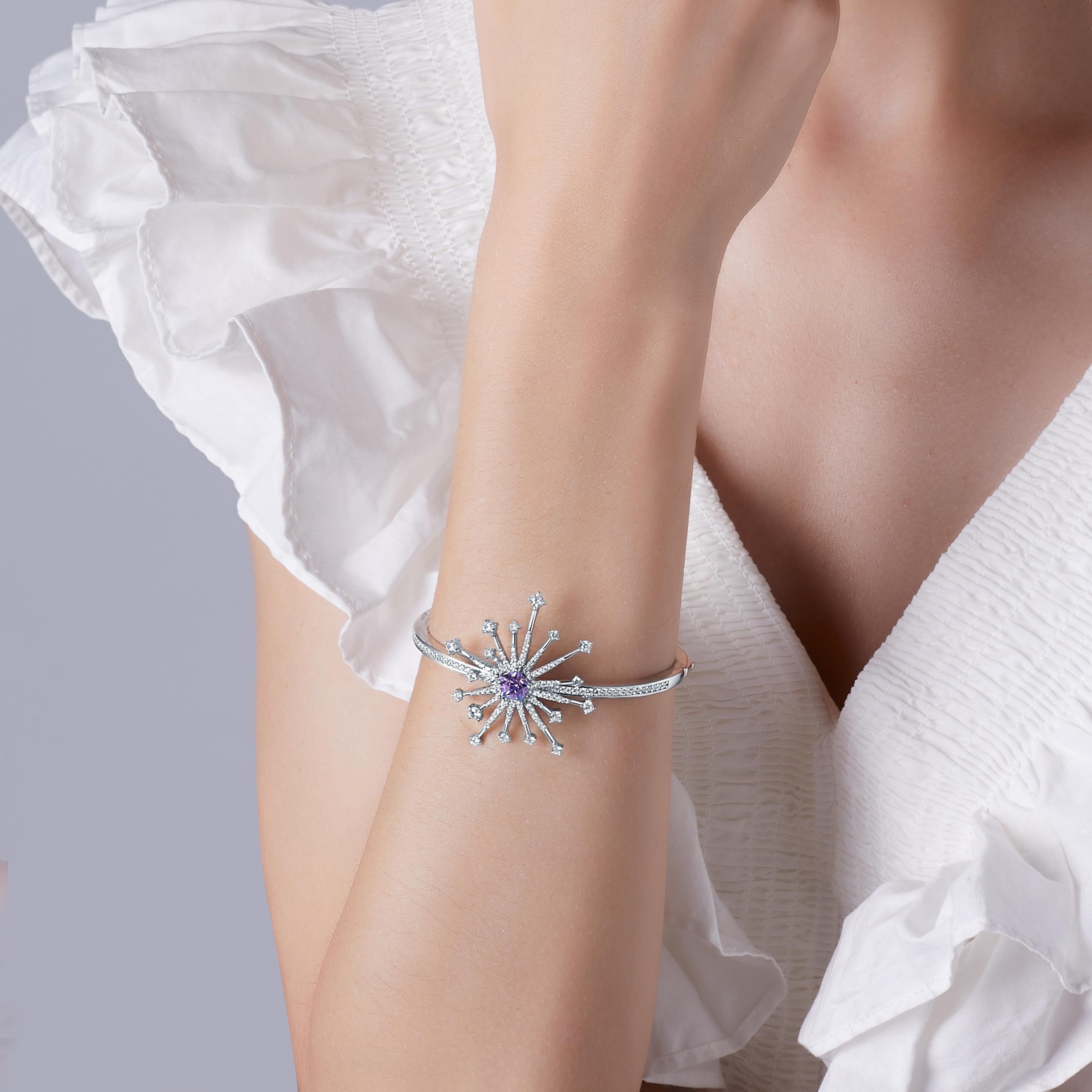 Description:
Light up the room with the new Carpe Diem Collection by Fei Liu! Carpe Diem 'Sparkler' bangle with Swarovski Purple-Aqua Pentagon Star cubic zirconia and 8 hearts and 8 arrows CZ, set in white rhodium plate on sterling