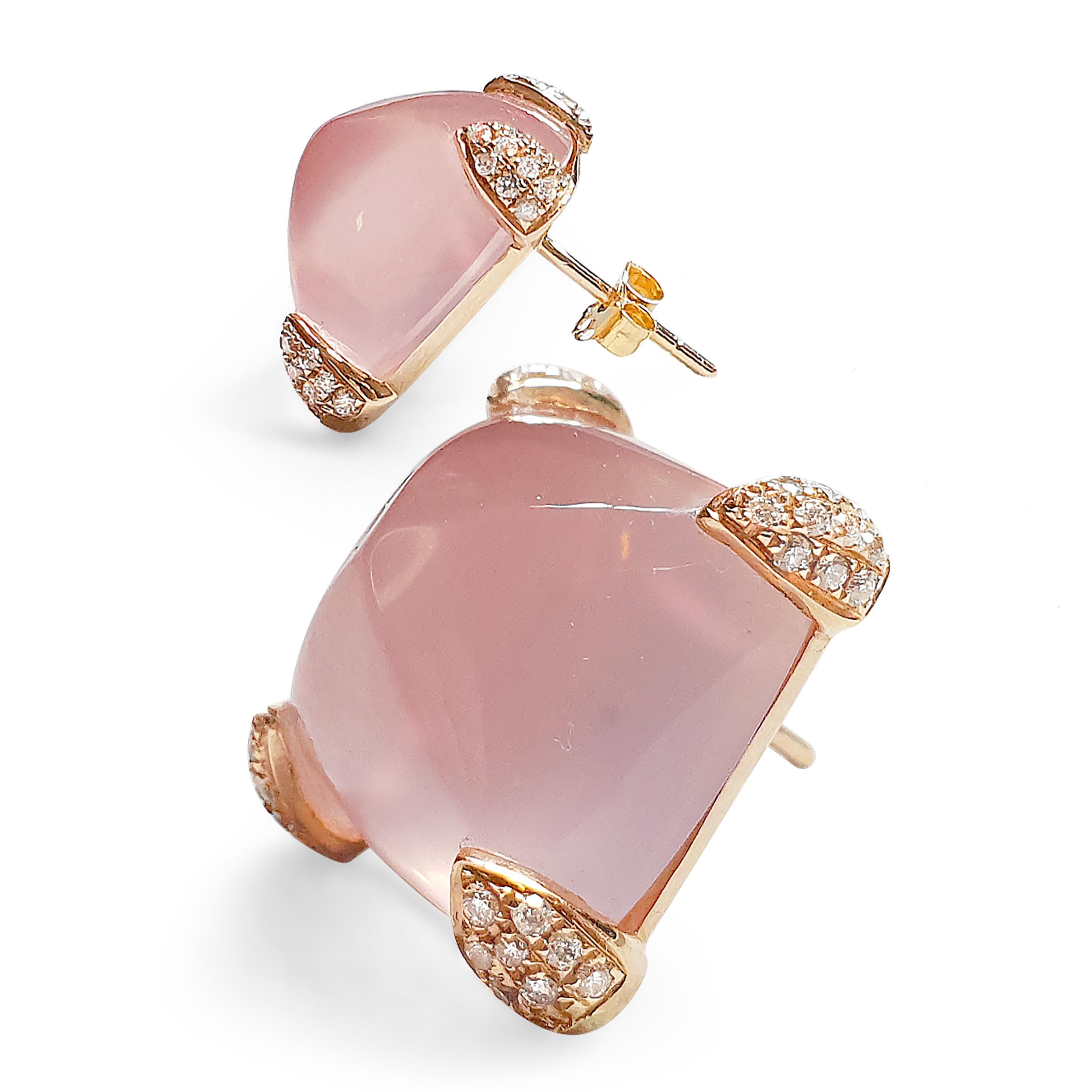 Description:
One-off asymmetric sugarloaf cabochon rose quartz earrings with diamond-set claws, set in 18ct rose gold.

Inspiration:
Enhancing the natural beauty of the rose quartz cabochon with the delicate sparkles of the diamonds. These earrings