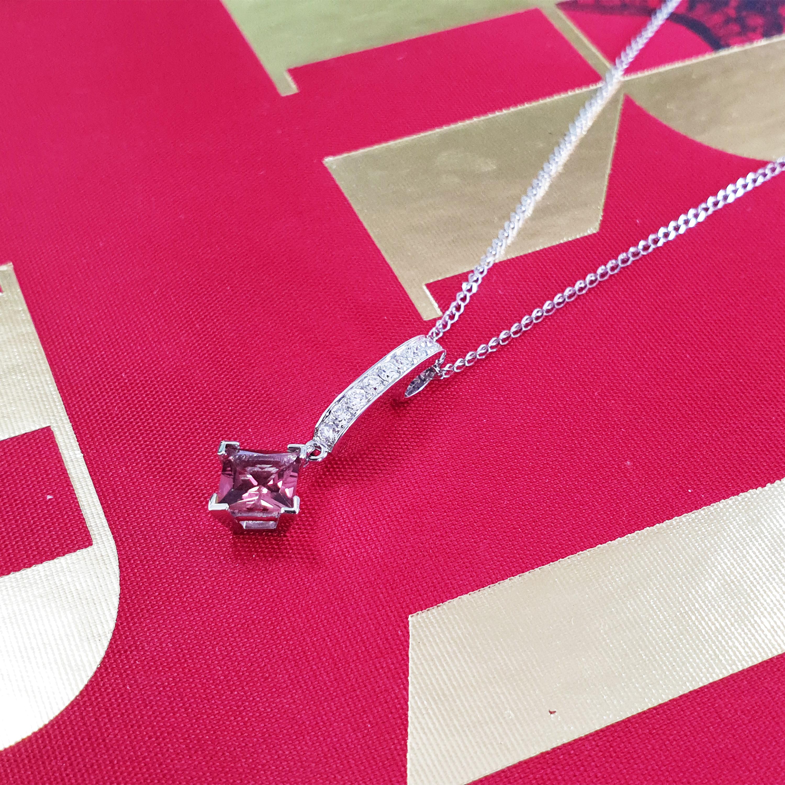 Description:
One-off 18ct white gold pendant by designer Fei Liu, set with a vivid 0.20ct rubellite and shimmering diamonds with a total weight of 0.30ct. Chain length is 16 inches.

Our rubellite pendant is an elegant and timeless jewel showcasing