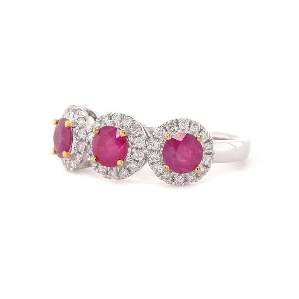 A three-stone ring seamlessly blends classic allure with a modern sensibility. The focal point of this timeless ring resides in its trio of captivating rubies, each cradled within delicate 18ct yellow gold plated claws. Each ruby is encircled by a