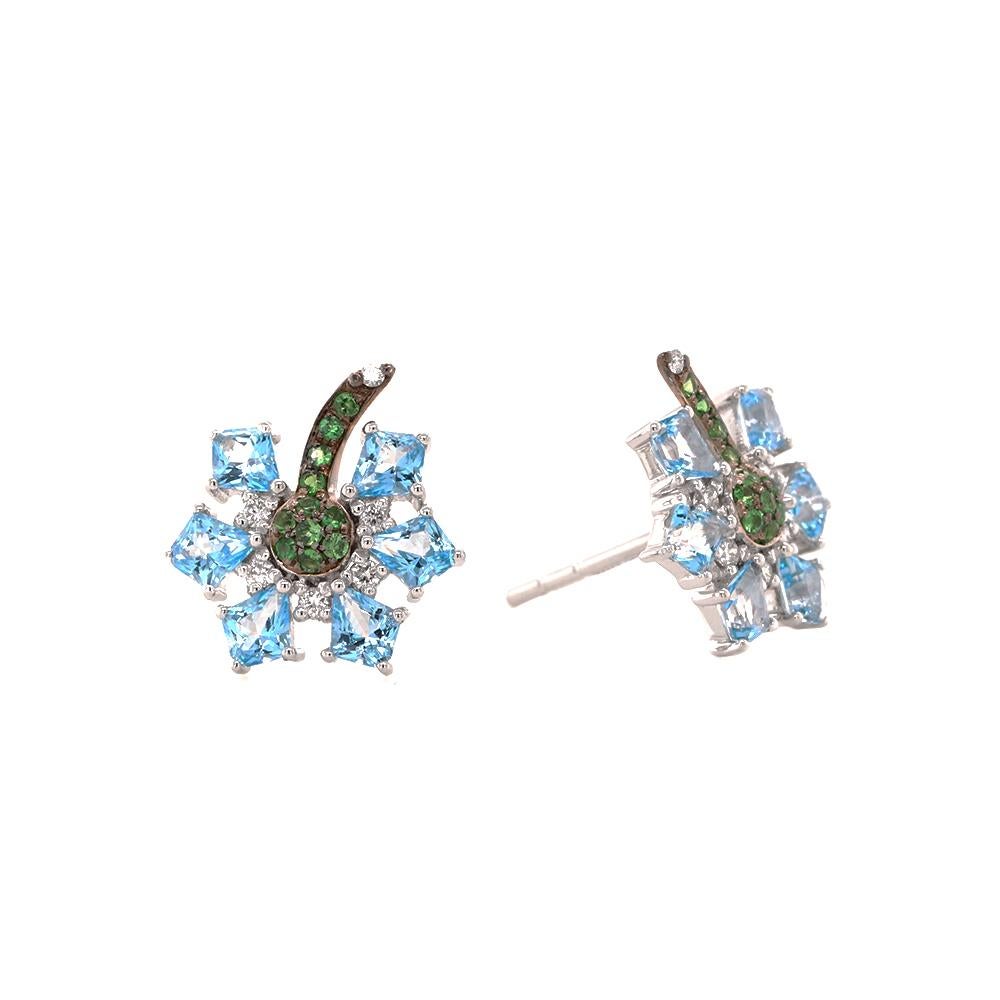 An exquisite creation in 18ct white gold by Fei Liu, epitomising his philosophy of vibrant elegance and effortless wearability. Each gem-set stud earring blossoms into a delicate floral motif, showcasing a cluster of 0.059ct tsavorites encircled by