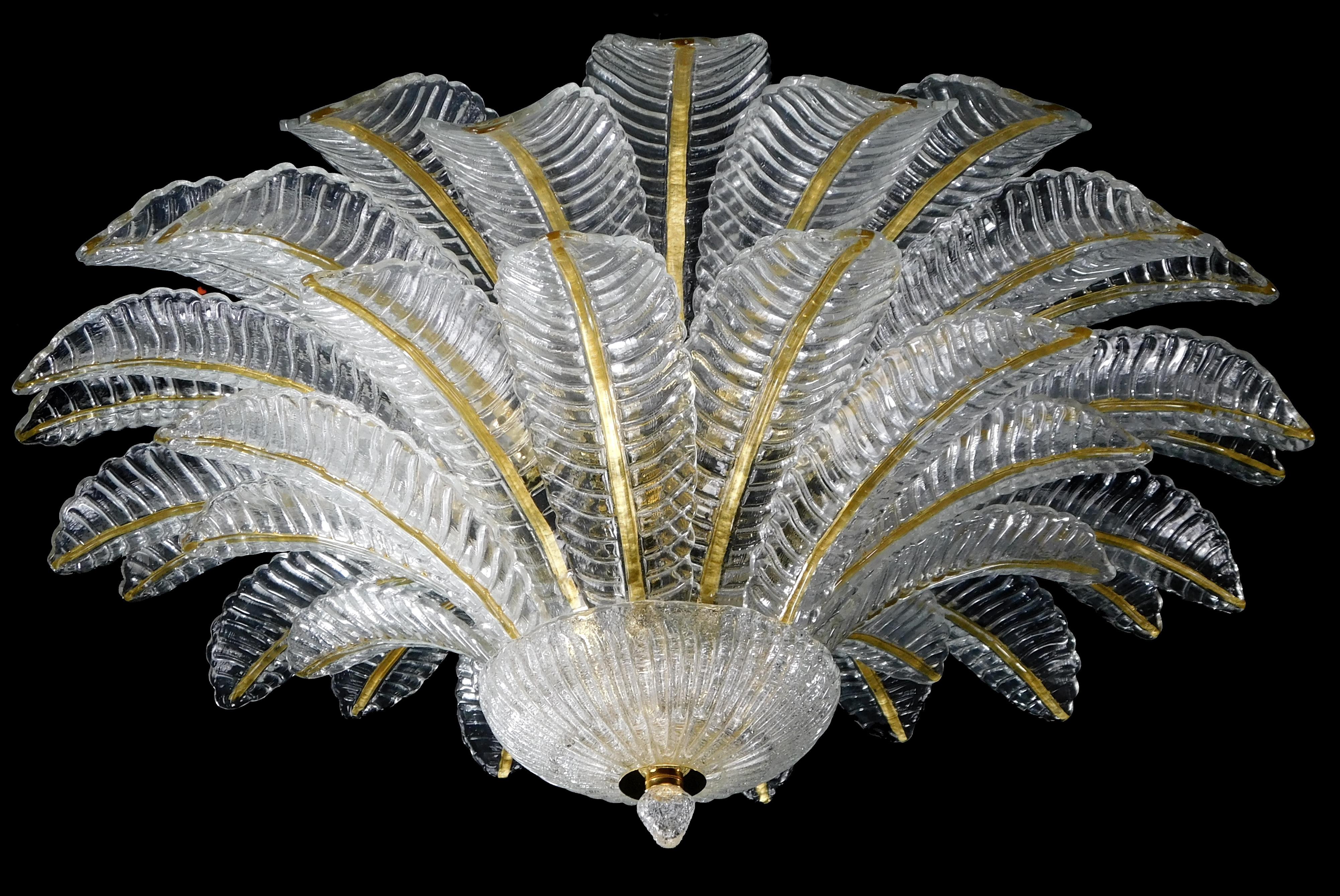 Italian flush mount with clear hand blown Murano Felci fern glass leaves infused with gold, mounted on 24 k gold finish metal frame by Fabio Ltd / Made in Italy
9 lights / E26 or E27 type / max 60W each
Measures: Diameter 39.5 inches, height 18