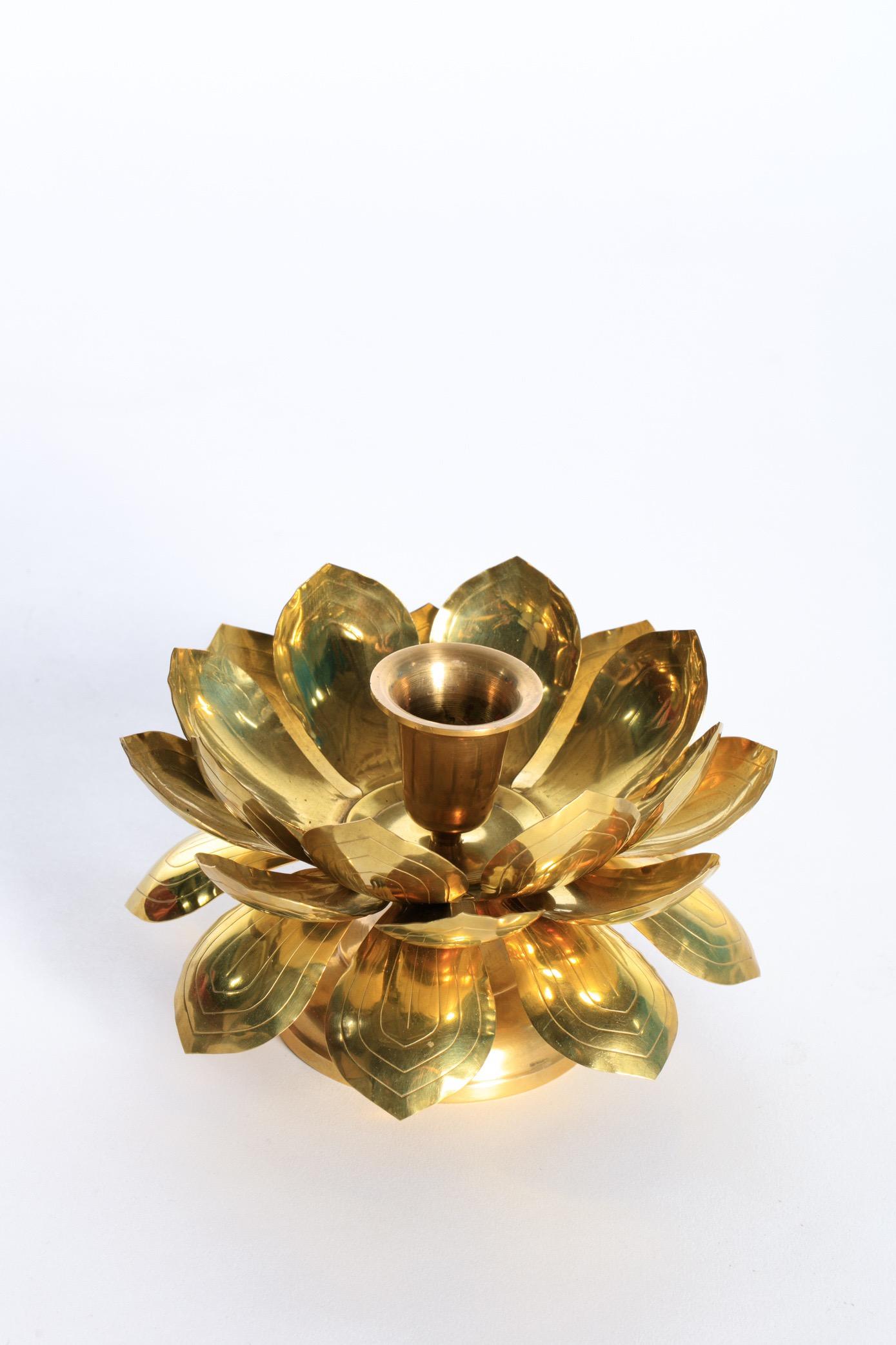 Beautiful brass lotus flower candle holders by Feldman Lighting in the style of Parzinger. Unique to most Feldman lotus flower pieces, the petals can be rearranged so the lotus flower is in early, mid or full bloom. Simply unscrew the candle cup and