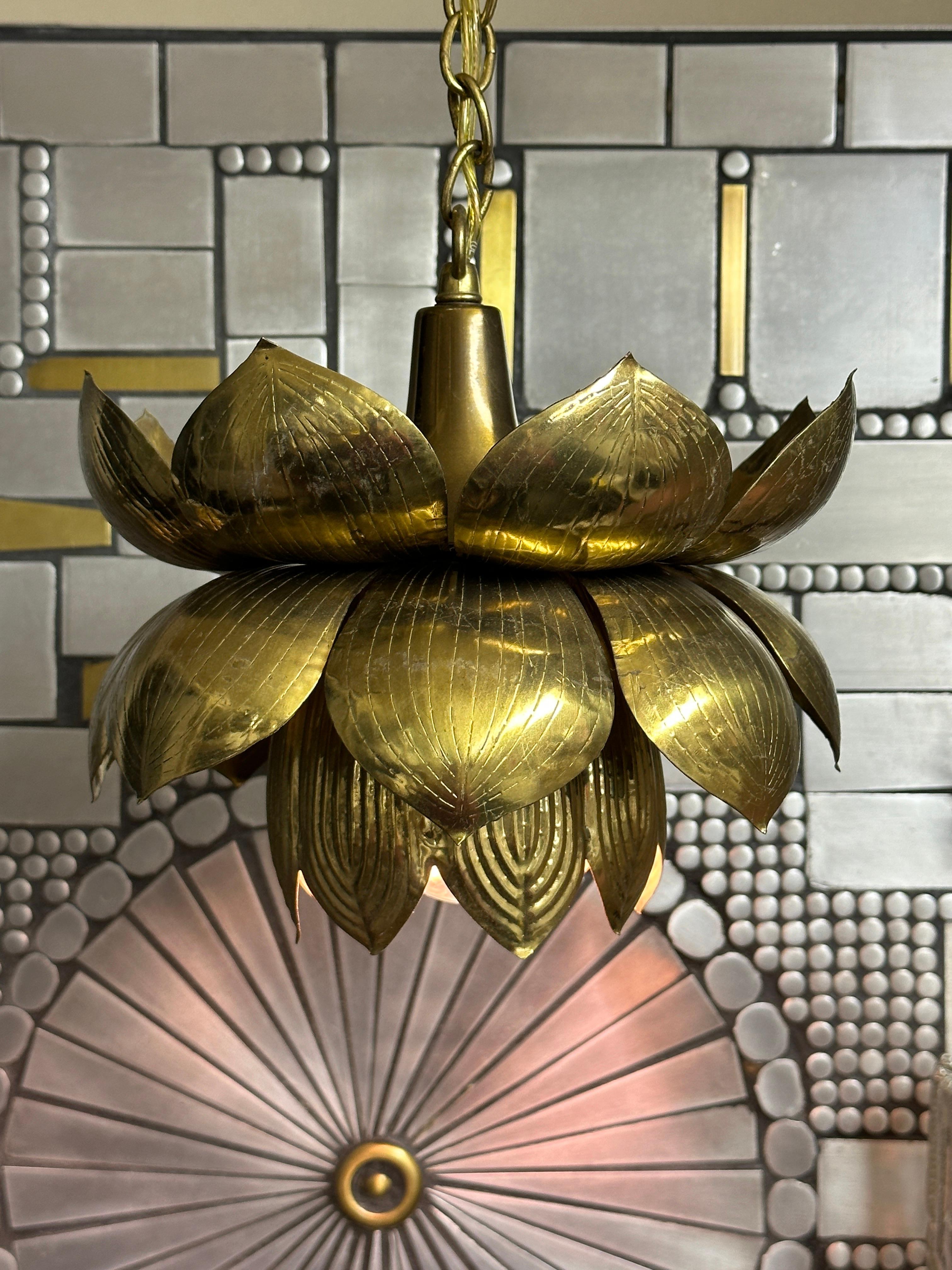 Feldman brass lotus hanging pendant light. Brass has not been polished and retains all original patina. Lotus itself is 10” diameter by 8 high.
Two available. Sold individually.