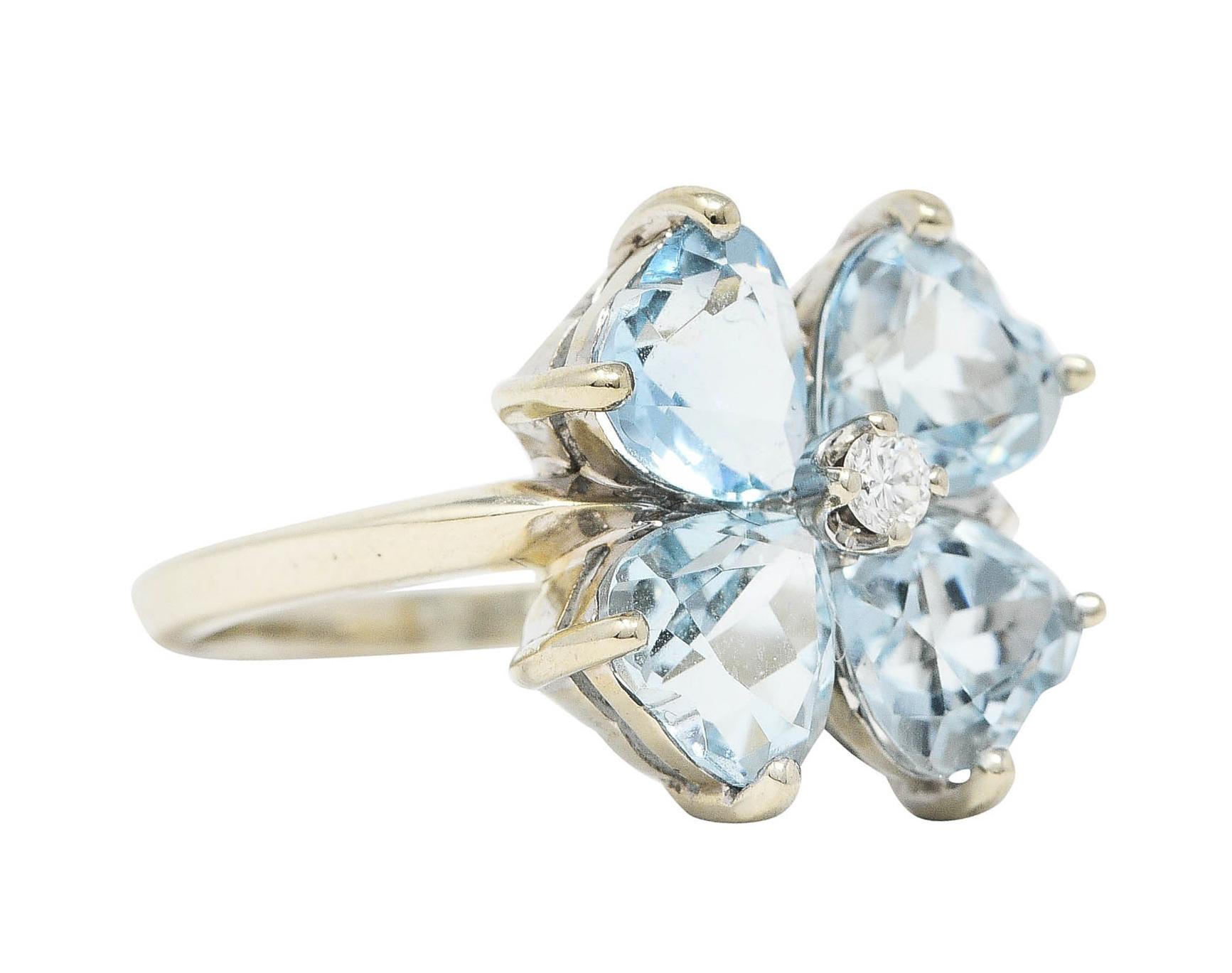 Designed as floral head consisting of four heart cut aquamarine petals

Transparent and slightly greenish blue in color with light saturation

Centering a round brilliant cut diamond weighing approximately 0.04 carat - eye clean and bright

Stamped