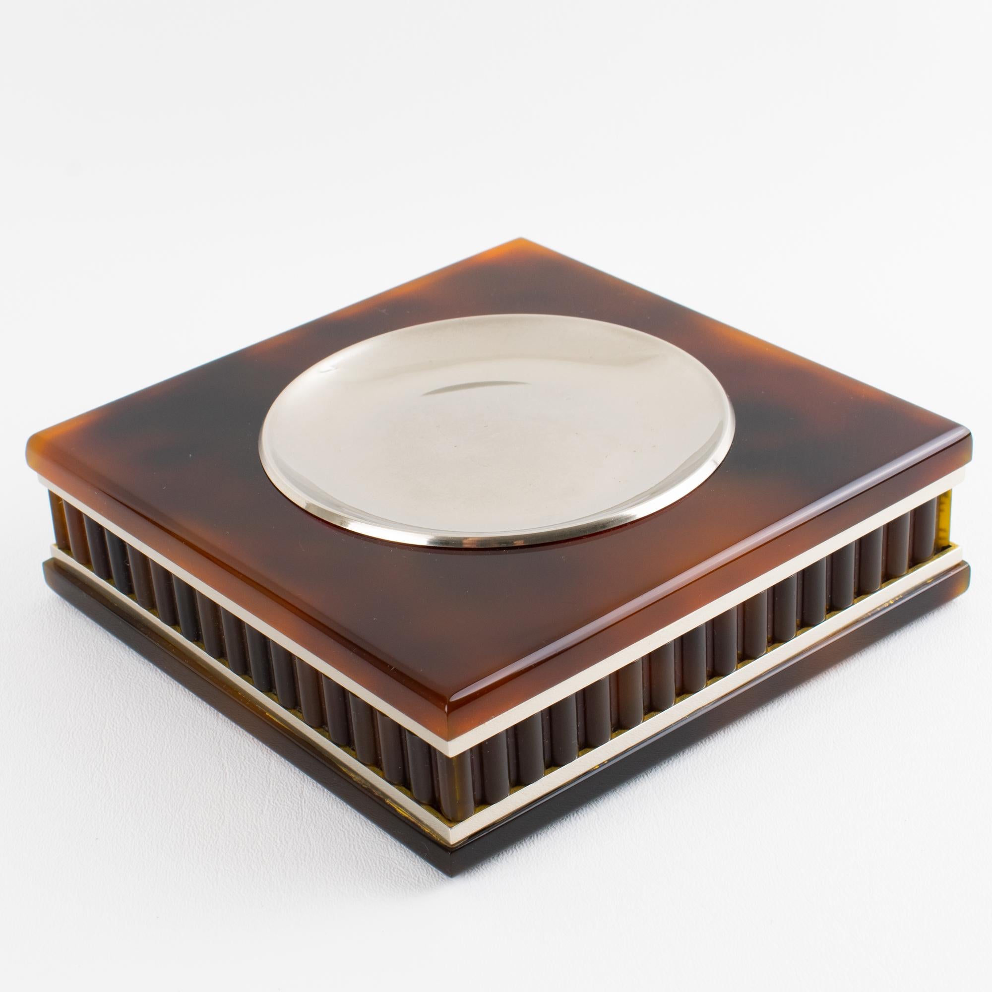 This stunning Lucite and chrome ashtray, vide poche or desk tidy, has a design reminiscent of the renowned Italian designer Felice Antonio Botta's work. The piece was expertly crafted in Italy circa 1970. The large catchall features an important