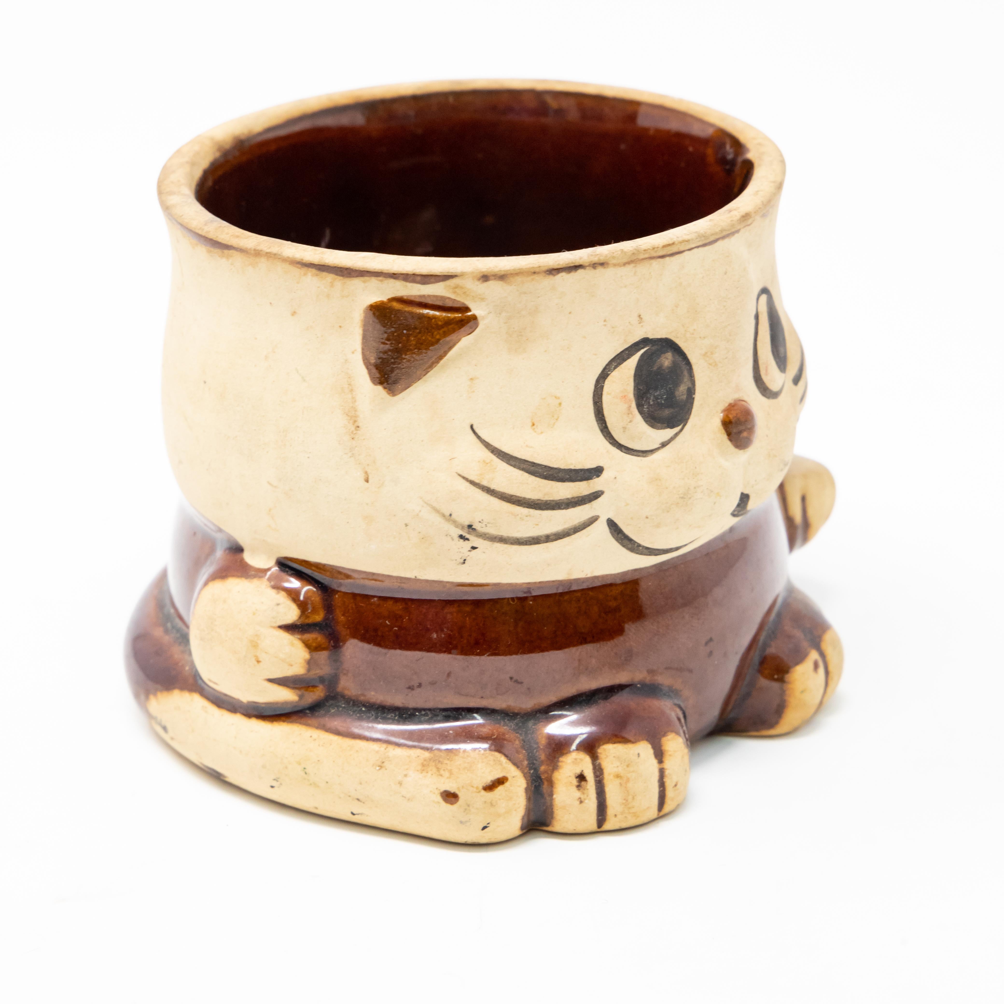 Offering a vintage feline themed mug. Brown and cream with a hand painted face.