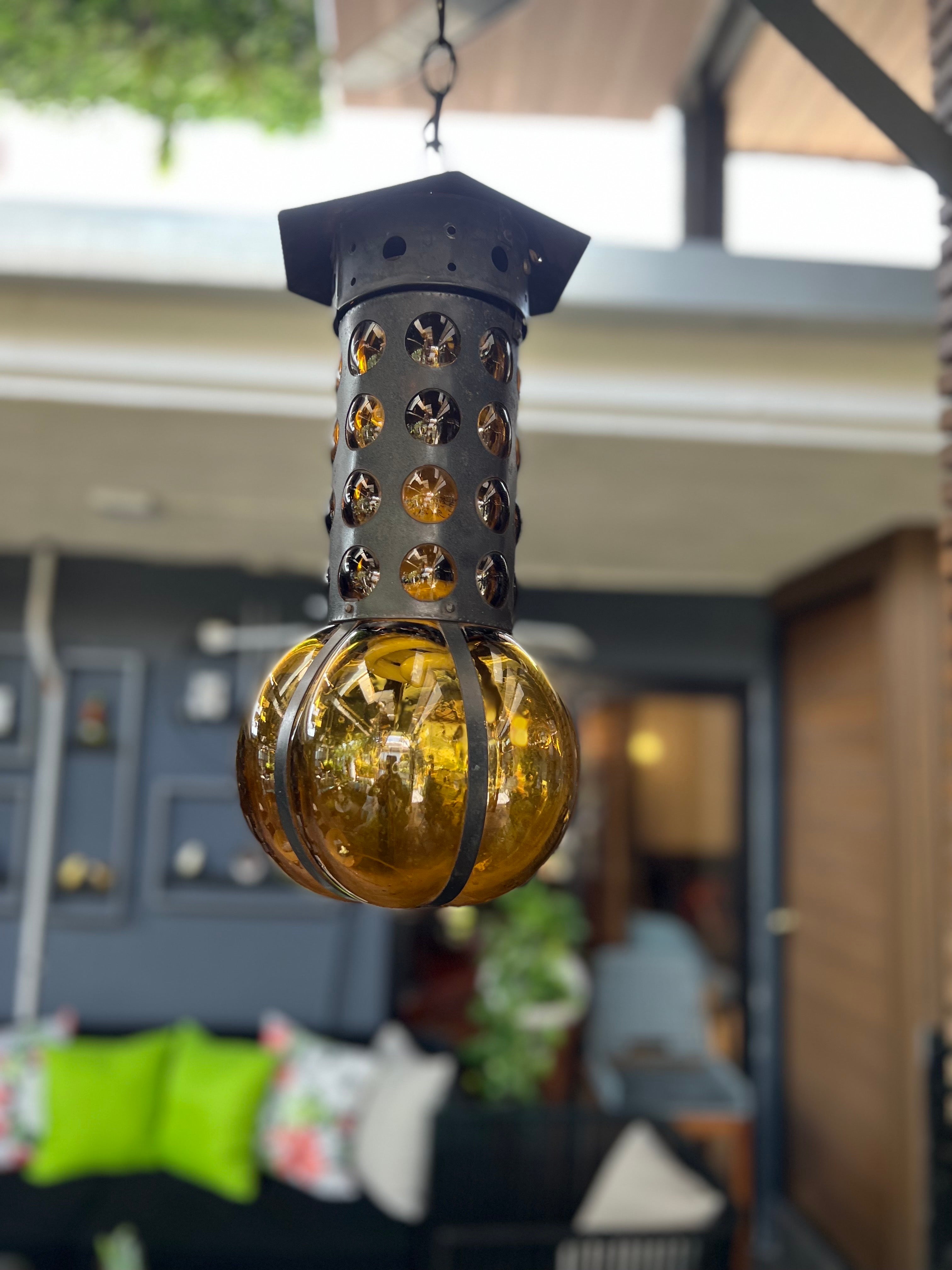 Blown glass manufactured by Feders and designed by Felipe Derflingher in amber color, Derflingher of this style made more glasses and bottles than lamps, that is why this type of pieces is no longer found on the market. The wire is the original, it