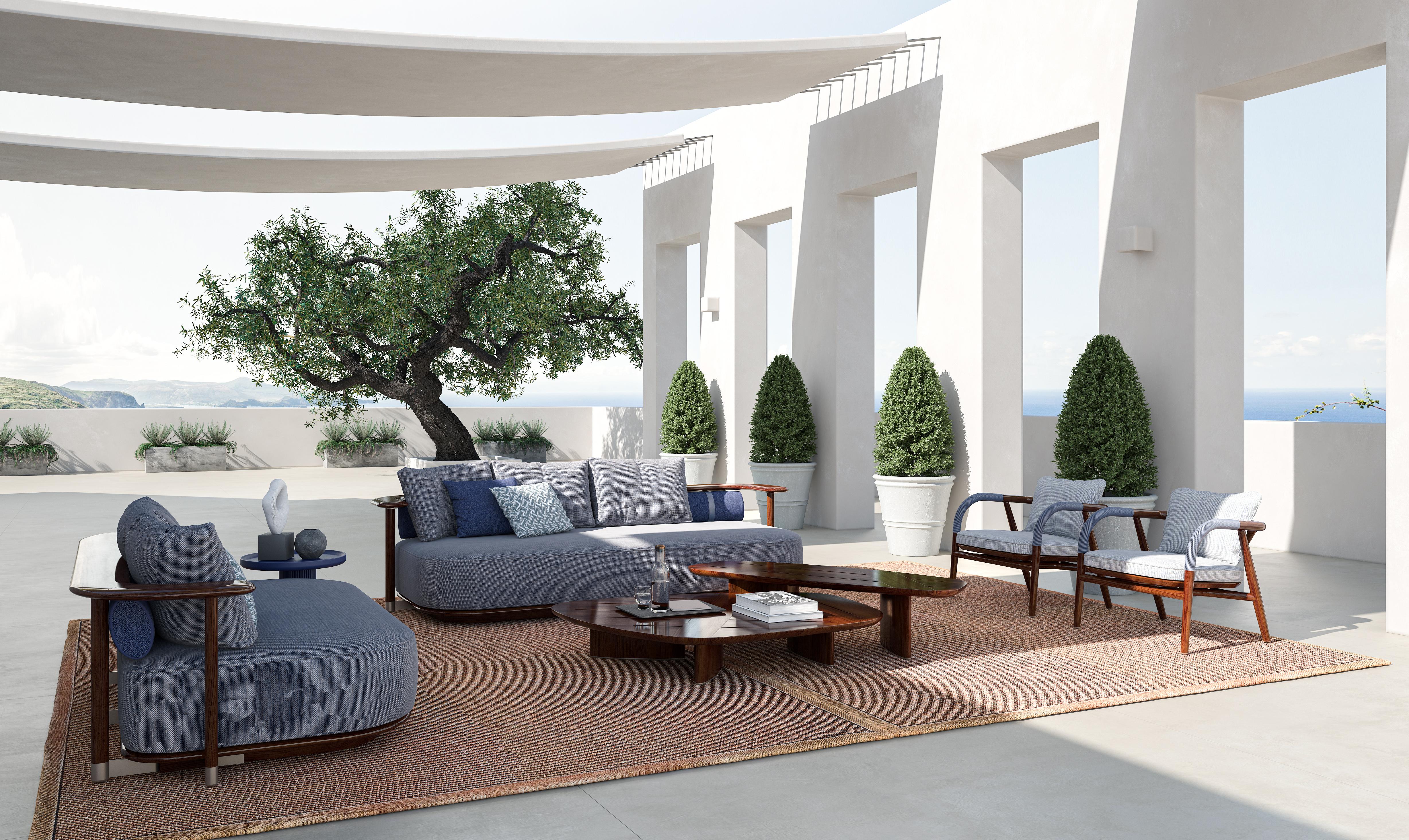 A rectangular outdoor coffee table with a glossy mahogany structure. The rich, polished mahogany construction exudes sophistication and durability, designed to withstand the elements while maintaing its elegant appearance. The table's smooth, glossy