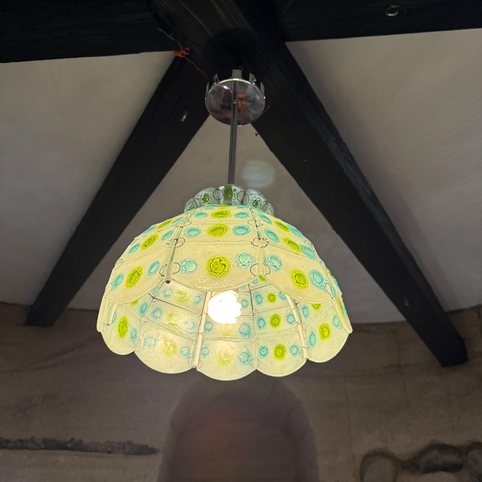 For your consideration,  a hand blown glass pendant- chandelier designed by Feliper Delfinger for Feders. Mexico circa the 1970s.
Dome constructed with glass tiles. Dominant color is white with light blue and light green accents bubbles.  Beautiful