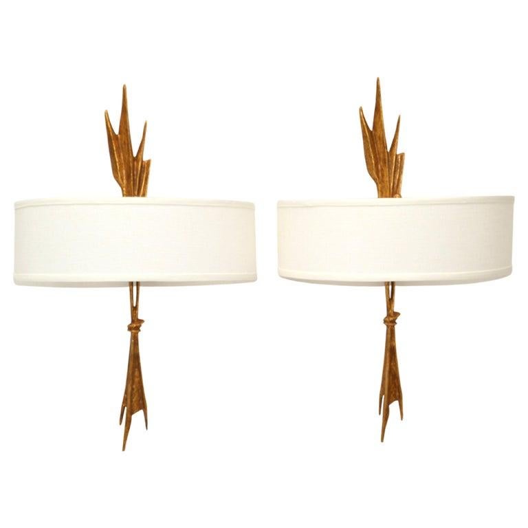 Pair of Amour Ardent Bronze Sconces, Wall Lights with Ivory Fabric Half-Shield Shades designed by Félix Agostini in France in the late 1950.
Wired for the US, each Sconces takes 2 E-14 Light Bulbs, max. 60 watts, or LED.
UL Listed and in perfect