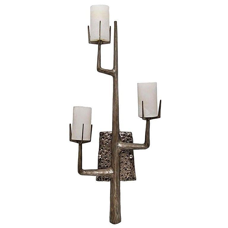 Pair of hand-cast, re-edition Felix Agostini style wall sconce, this organic-based modernist design features a unique mix of nature and modernist aspects. The sconce consists of three arms each with a three-inch Spanish white alabaster shade. The