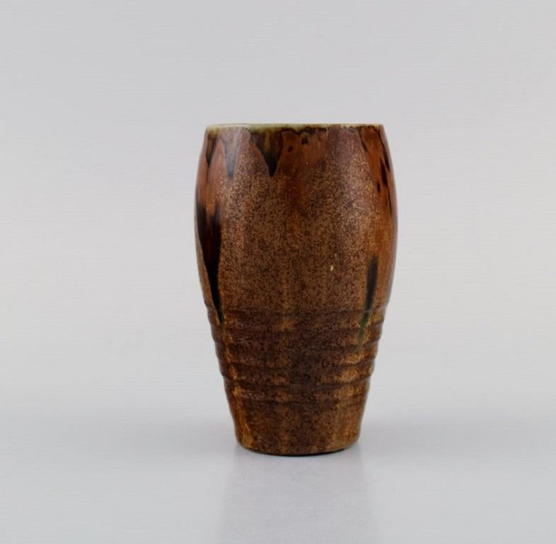 Felix-Auguste Delaherche (1857-1940), France. Vase in glazed ceramics. 
Beautiful glaze in brown and dark shades. 1920s.
Measures: 11.5 x 7.5 cm.
In excellent condition. Small glaze defects on the bottom from production.
Stamped.
Felix-Auguste