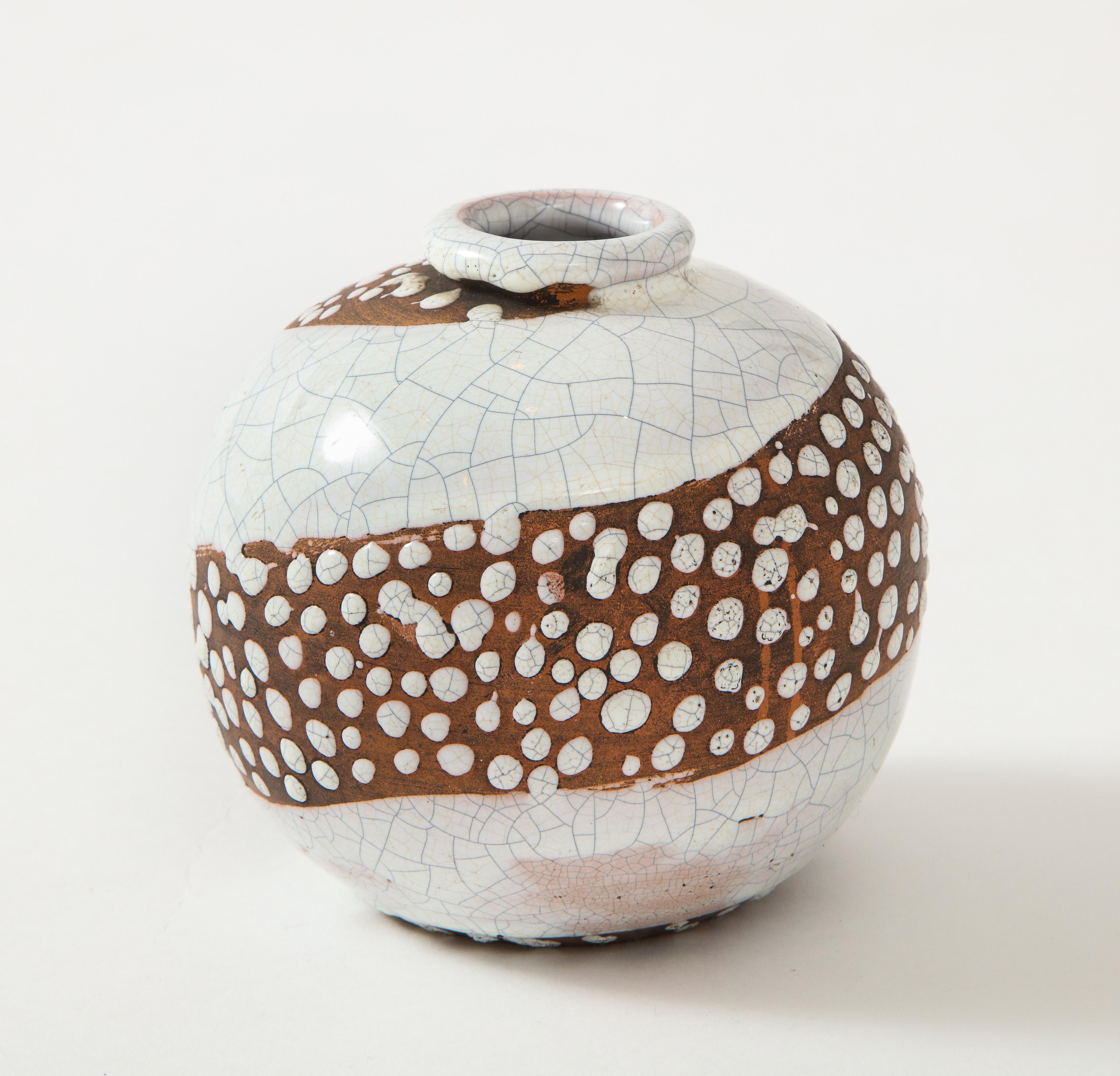 Felix Gete small Art Deco sphere shaped vase, C. A. B., France, circa 1930
Small brown & off-white sphere shaped Art Deco vase by Felix Gete, C. A. B. Bordeaux Art Ceramics, France, circa 1930, marked/numbered
Ceramic
Measures: Height 4.5,