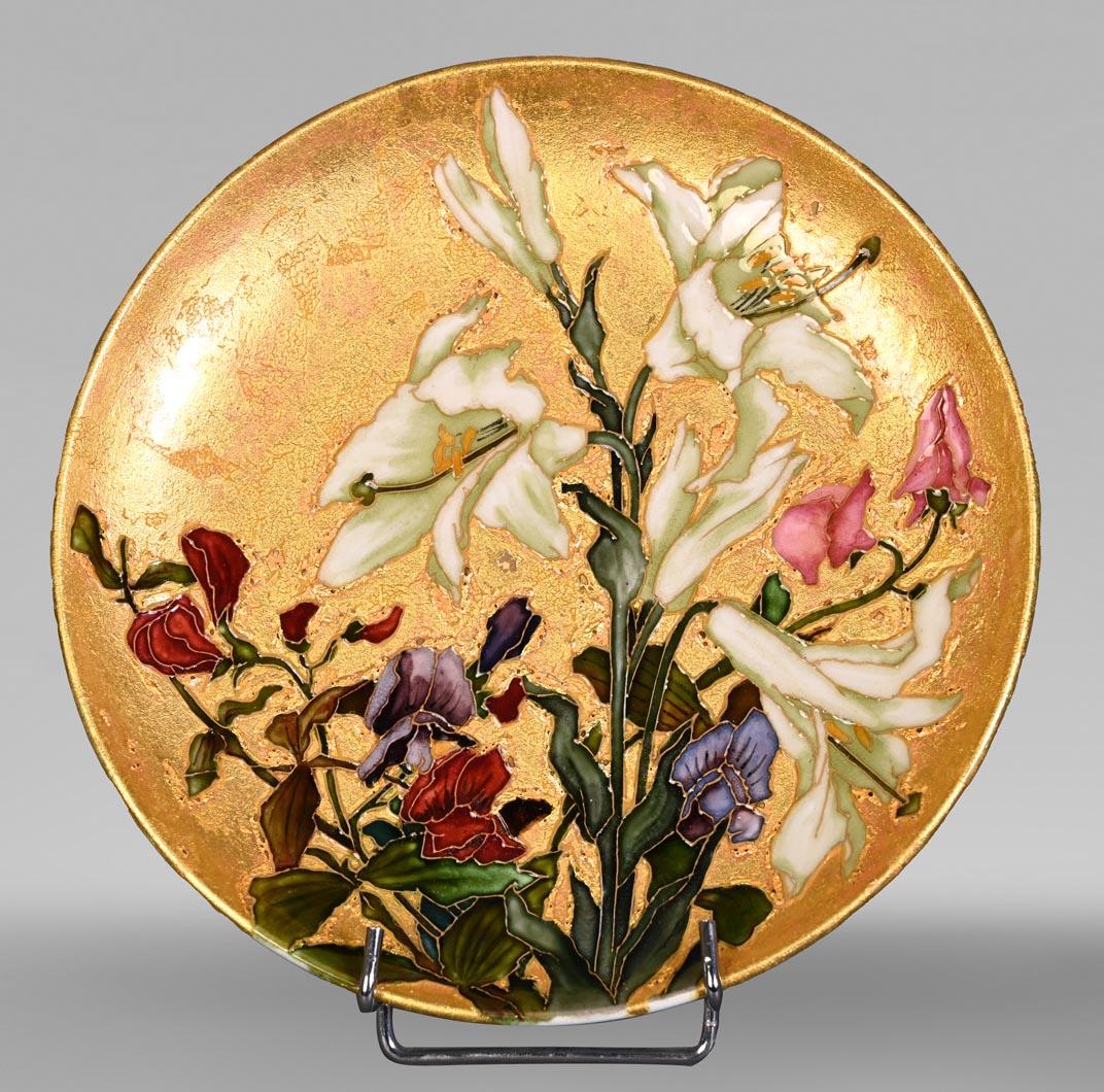 This beautiful dish with a gold background and flower decoration signed “Milet Sèvres” was made by Félix Optat Milet in polychrome enamelled ceramic and gold background. It is treated in the manner of a cloisonné. This technique was also used by his